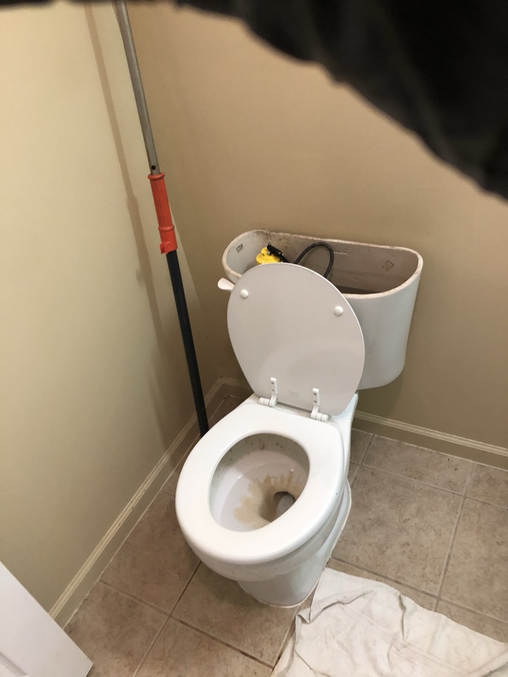 Unclog toilet with closet auger, adjust water level and flapper chain.