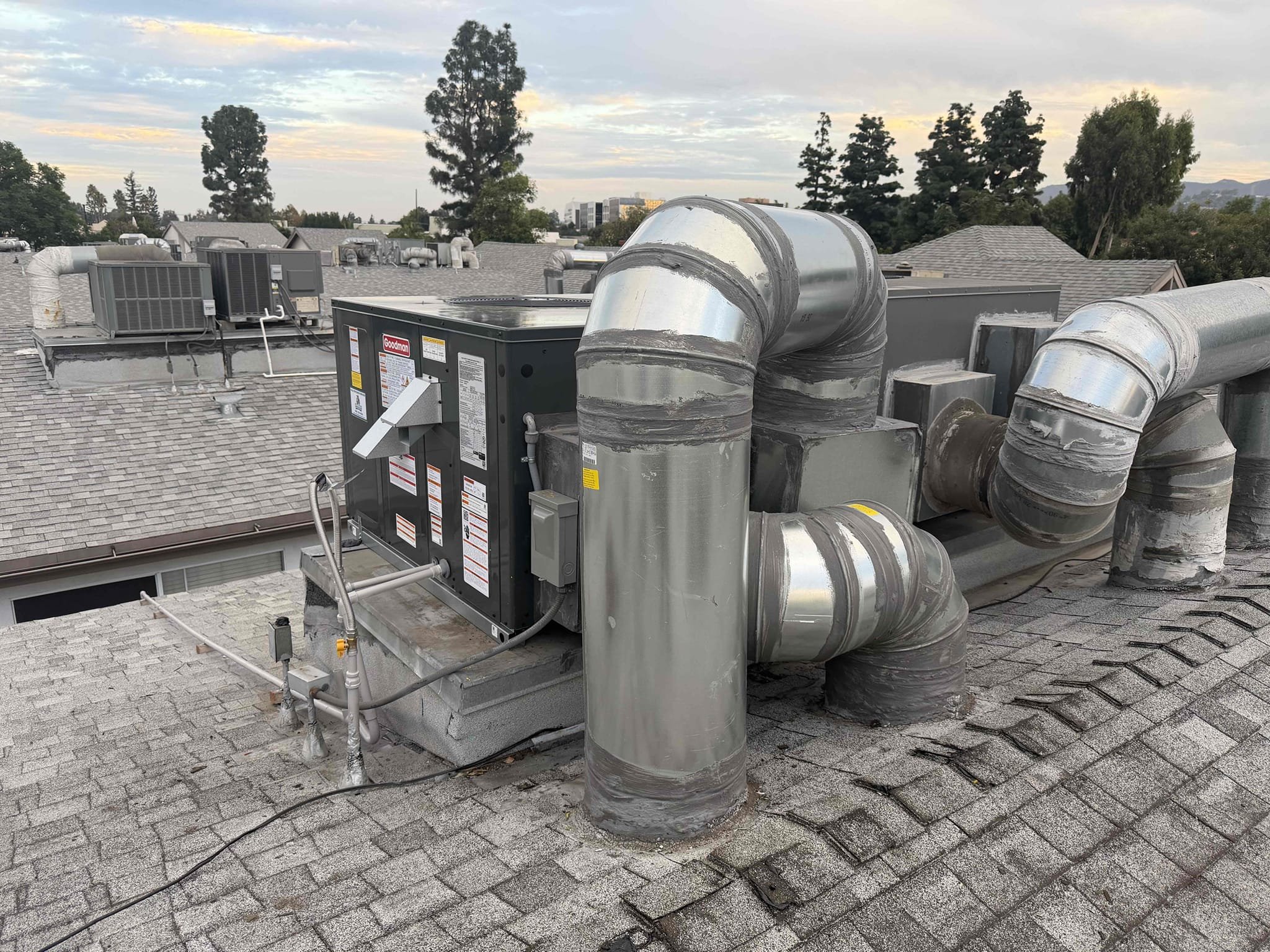 I am a skilled professional that works for a Affordable Heating and Air company. I recently completed a job for a customer who needed a new Goodman 13.4 SEER 2-ton package unit installed. The job included removing the existing unit, providing and installing a new disconnect box, electrical power whip, flex gas line, sediment trap, Glencote seal, reconnecting to and blowing out existing condensation lines, providing a crane to transport the package unit to the roof, and including permits and title 24 HERS testing. The payment method was 10% deposit or up to $1000/70% upon crew arrival with equipment/20% upon start-up of the unit. The Goodman warranties included a 1-year labor warranty, 10-year limited warranty on parts, 10-year limited warranty on the compressor, and 20-year limited warranty on the heat exchanger.