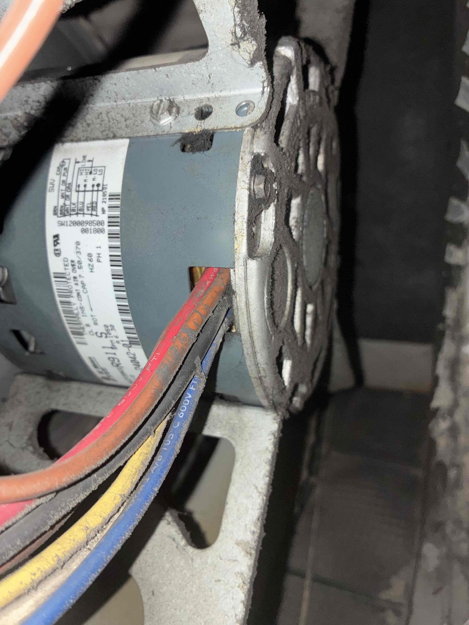 Upon inspection of the 2004 Rheem Furnace, I found the blower wheel heavily soiled, the blower motor leaking oil, and the capacitor weak. These issues cause inconsistent airflow and difficulty maintaining the set temperature. I recommended cleaning the blower wheel, replacing the blower motor and capacitor, and upgrading the thermostat for better control. Despite the furnace's age, repairs can improve performance, though replacement may be necessary in the future.