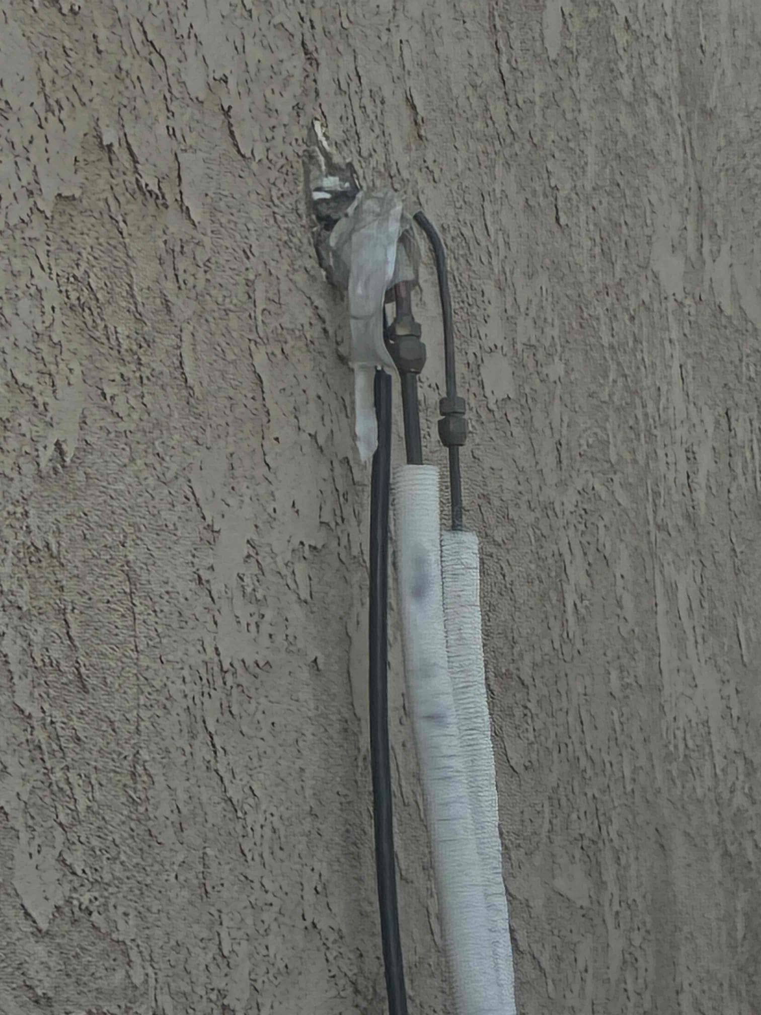 I diagnosed a Copper & Hunter 2-Zone Mini Split system that wasn't cooling effectively. Refrigerant pressures were around 34 PSI, suggesting a significant loss. The outdoor unit showed oil residue around the compressor fittings, indicating a leak. The system, installed by a friend, required reflared refrigerant line set connections, a deep vacuum, and recharge with 4.4 lbs of R-410A. Post-repair checks confirmed proper operation and cooling performance, resolving the no-cooling issue.