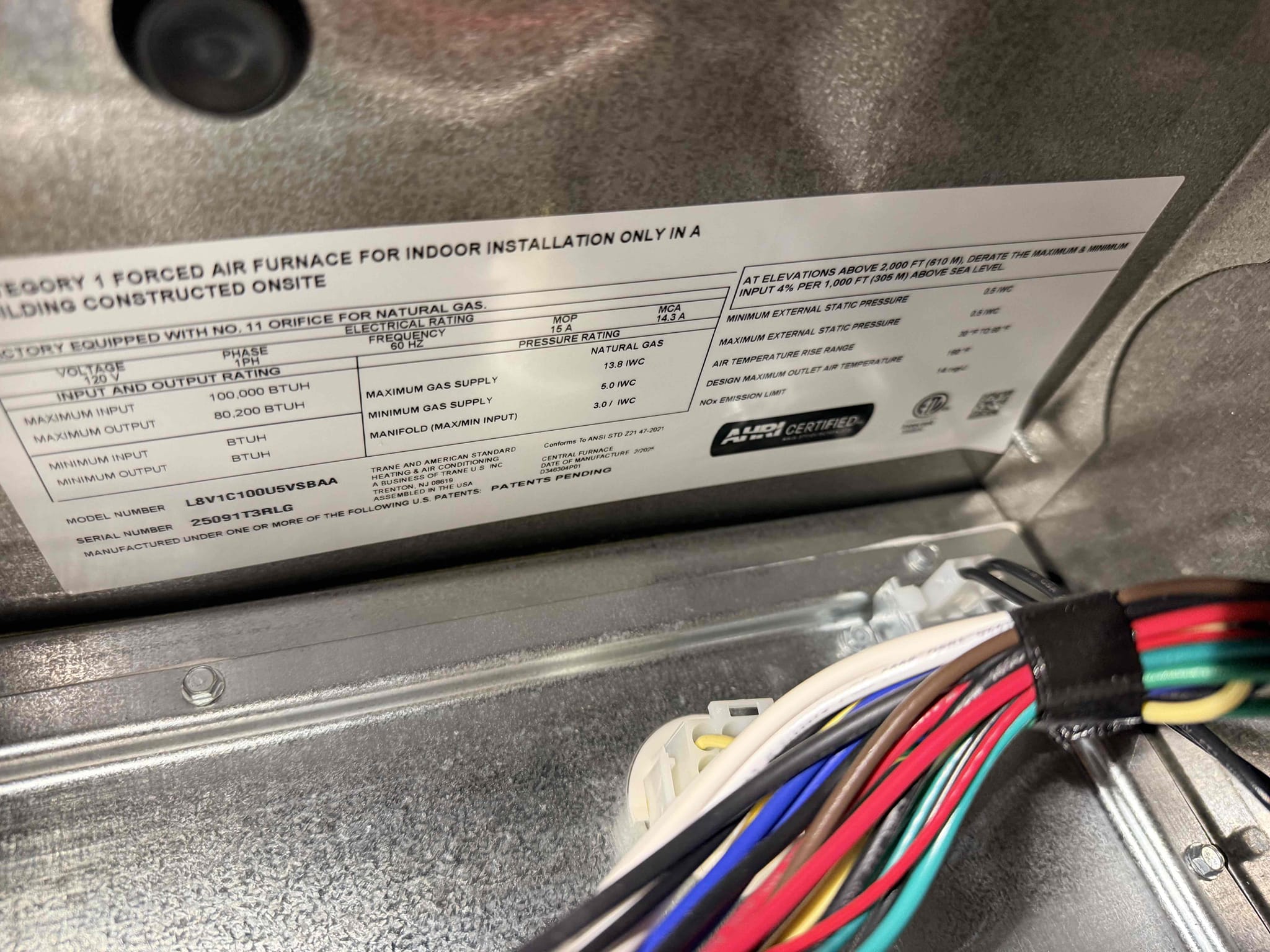 During the inspection, the unit was non-operational, displaying an E17 error code. I began by examining the blower motor and ensuring its continuity. I then verified that 120 volts were present at the motor. However, no 12 volts were detected on the communication wires between terminals 1 and 3. This indicated a potential issue with the control board, which is responsible for sending the necessary voltage. To resolve the problem, I ordered a replacement control board and a motor, as it's possible the motor could also be defective.
