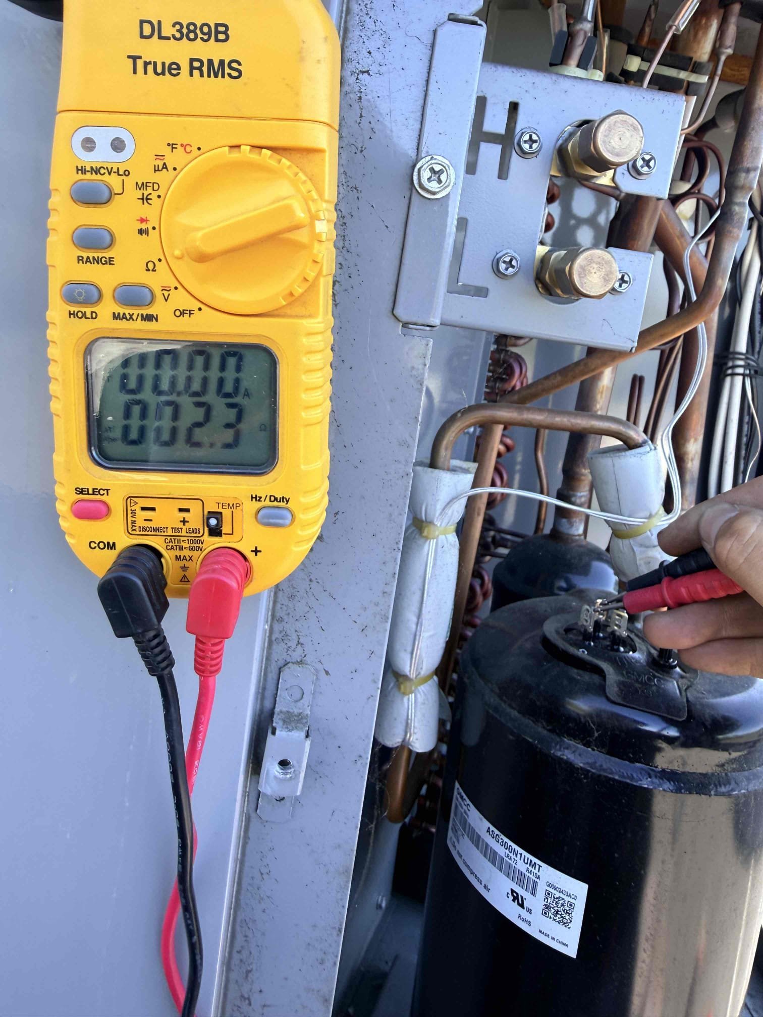 Upon inspection, the system was not cooling, with both return and supply temperatures at 85 degrees. The fan in the package unit was operational, but the compressor was not engaging. I checked the capacitor, which was low, and replaced it. Despite this, the compressor did not start. I then took resistance readings on the compressor, which were abnormal, and noted the surface temperature was high at 139 degrees. Although 240 volts were reaching the compressor, it attempted to start but failed. Further investigation revealed the issue was likely due to a faulty compressor, which was subsequently replaced.