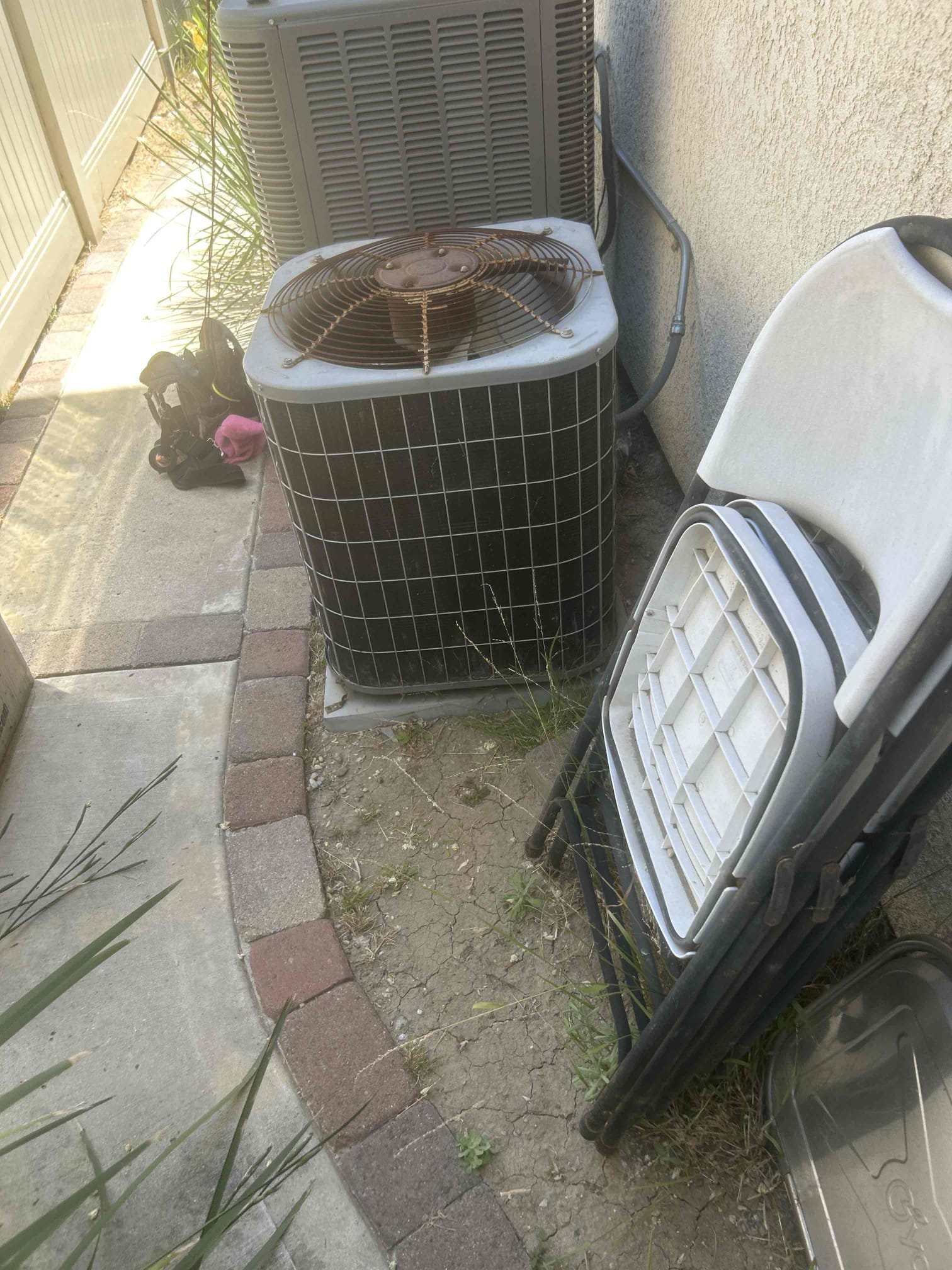 Upon arrival, I assessed an AC system that was not functioning. The equipment, an older R-22 model, was found to be non-operational. The compressor was burnt out, and the harness was melted. Additionally, the system had a tripped breaker, a faulty capacitor, and was heavily soiled. To ensure proper operation, the compressor needed replacement. I also discovered that the condenser fan motor was rusted out. Given the age and condition of the equipment, I strongly recommend replacing the entire system.