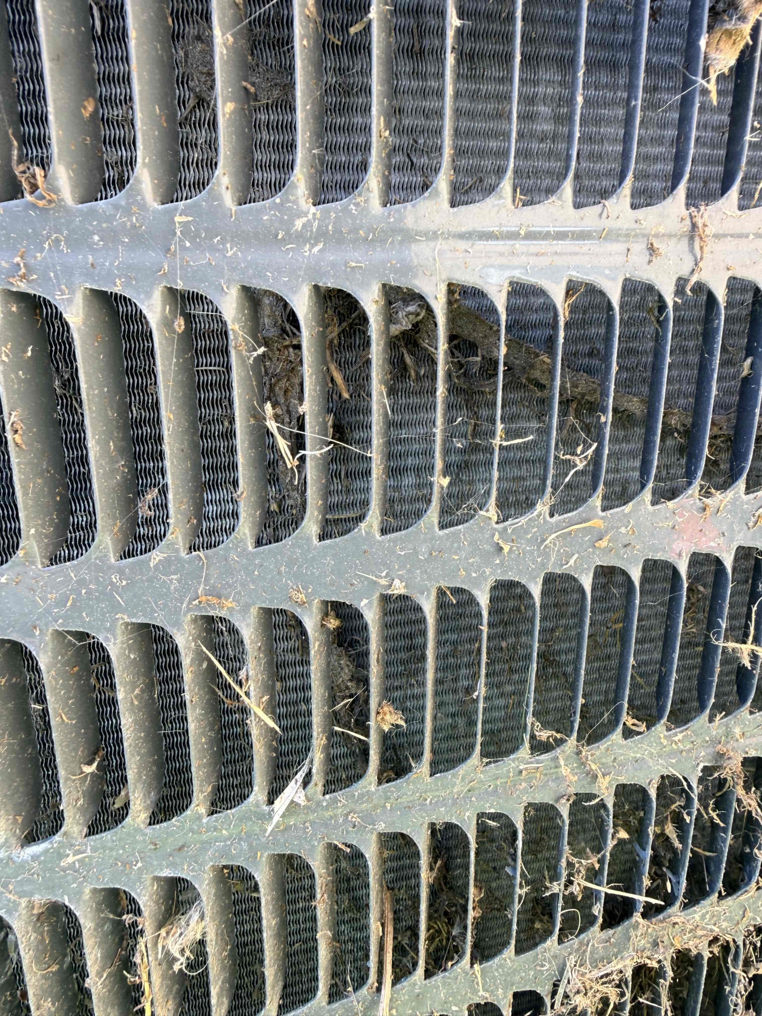 During the inspection, I thoroughly examined both the condenser unit and the air handler. The condenser unit's capacitor was found to be faulty, as its reading was below the required specifications, necessitating replacement. Additionally, the condenser coil was slightly dirty, requiring a deep cleaning to ensure optimal performance. Fortunately, the contactor, blower motor, and control board were all in excellent condition. Inside, the blower motor was slightly dirty but still functional. The control board and transformer were also in good shape, showing no signs of wear or damage. Overall, the inspection revealed that only the capacitor and condenser coil needed attention.