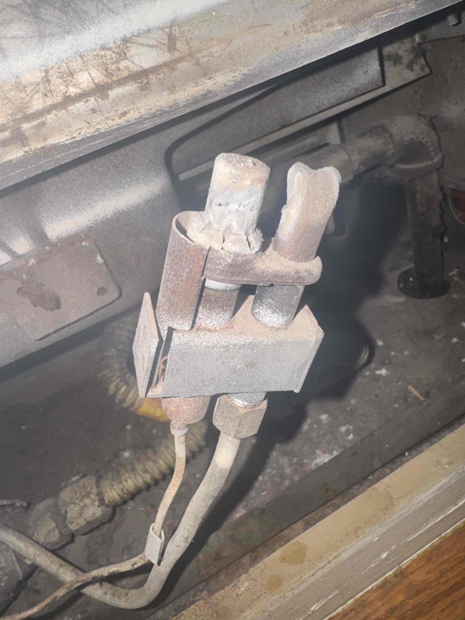 I conducted a thorough diagnostic inspection of the wall furnace due to operational and safety concerns. I examined the burner compartment, pilot assembly, thermopile, gas valve, and safety controls. The thermopile tested at approximately 480 mV DC, indicating it is generating sufficient power. However, a gas leak was detected at the pilot assembly, which showed significant age-related deterioration, corrosion, and contamination. Additionally, heavy dust and debris accumulation were found throughout the burner compartment. Due to the active gas leak, I recommend repairing the pilot assembly immediately. Continued operation is not advised until the leak is corrected. I conducted a thorough diagnostic inspection of the wall furnace due to operational and safety concerns. I examined the burner compartment, pilot assembly, thermopile, gas valve, and safety controls. The thermopile tested at approximately 480 mV DC, indicating it is generating sufficient power. However, a gas leak was detected at the pilot assembly, which showed significant age-related deterioration, corrosion, and contamination. Additionally, heavy dust and debris accumulation were found throughout the burner compartment. Due to the active gas leak, I recommend repairing the pilot assembly immediately. Continued operation is not advised until the leak is corrected.