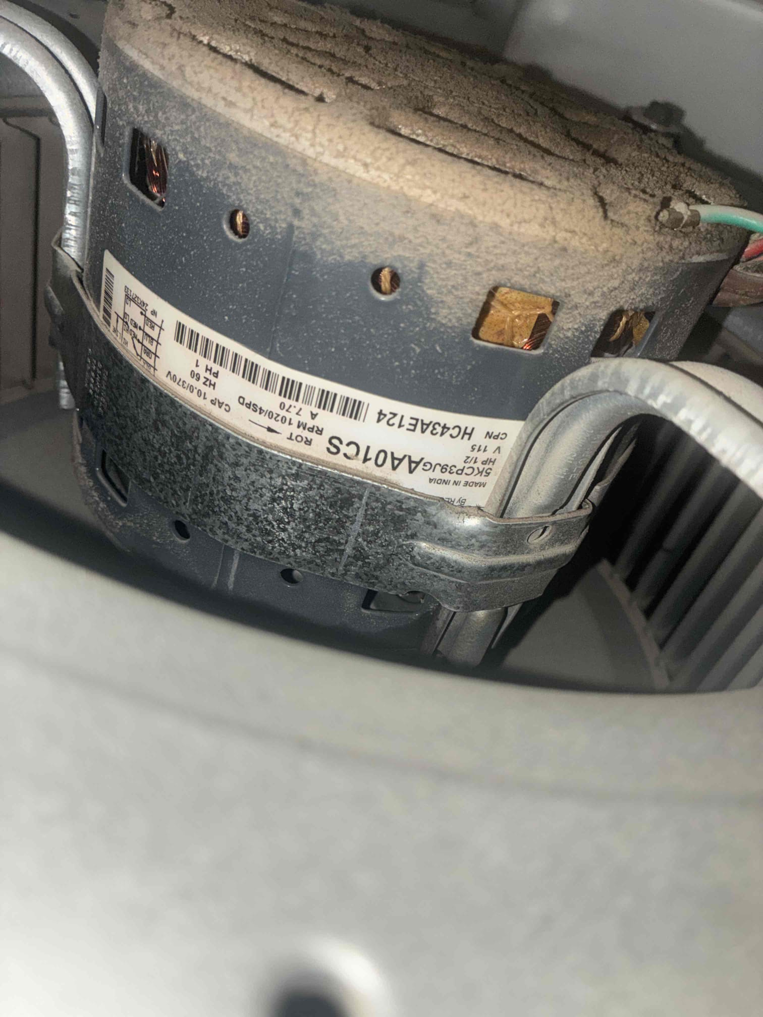 I conducted a thorough diagnostic of the HVAC system, finding it slightly low on refrigerant and with a leaking oil blower motor. Despite the thermostat being set correctly, the system was blowing warm air. The condenser's electrical components were tested and found to be within specifications. The indoor air handler showed signs of wear, particularly the blower motor. I recommended adding R-22 refrigerant with leak sealant and UV dye, and replacing the blower motor. However, due to the system's age and condition, this is a temporary fix. For long-term reliability and efficiency, I advised replacing the entire HVAC system.