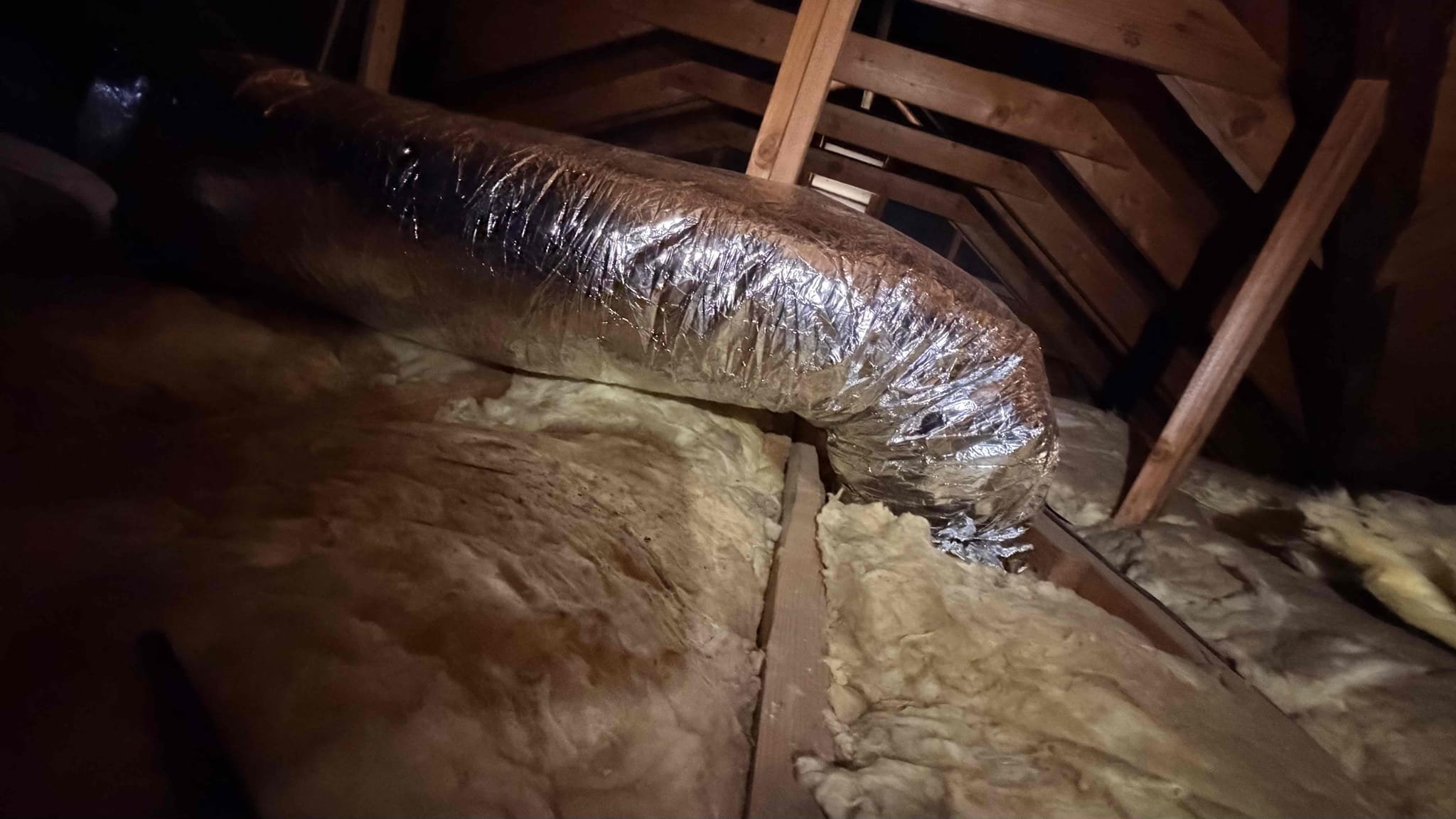 Los Angeles, CA - We replaced three deteriorated supply ducts in the rear portion of the home with new insulated R-8 flex duct to improve airflow and comfort. The old ducts were restricted, contributing to poor airflow in the rear bedrooms. The new ductwork was installed, sealed, and supported according to manufacturer standards. During the repair, we also inspected the remaining duct system and found the supply plenum uninsulated, causing heat gain in the attic. The return configuration is original and could benefit from modernization. The homeowner chose to complete only the airflow repair, but we recommended replacing the remaining aging ductwork and installing new insulated supply and return plenums for better airflow balance, efficiency, and comfort.