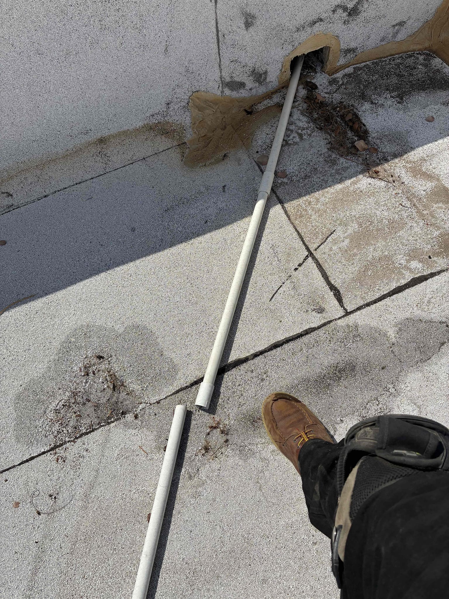 Completed a maintenance and safety inspection on a 2021 American Standard package unit. Changed the dirty 14x24x1 filter. Checked temperatures and refrigerant pressures on the roof, finding normal readings. Noted a light brown tint on the evaporator coil and dirt on the blower wheel, recommending a cleaning for next summer. Discovered the condensation drain line was broken and improperly connected, causing water to drain onto the roof. Advised securing the piping to prevent roof damage and drainage issues.