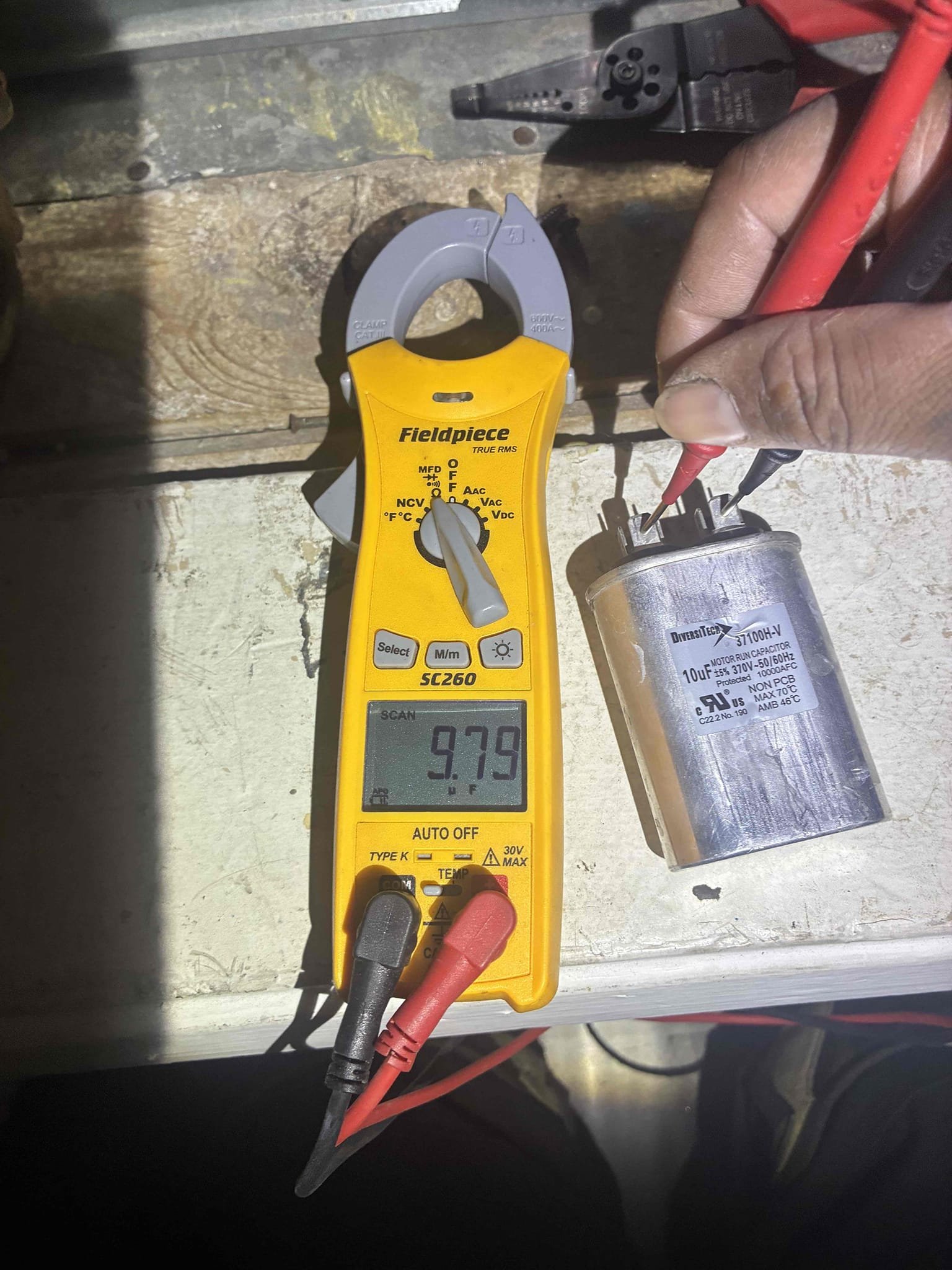 I conducted a thorough inspection of the 2024 AC Pro M-Series System with Coil. The system is currently cooling effectively, with refrigerant pressures and temperature readings within the acceptable range. The air output is at the correct temperature.
Upon inspection, I identified that the blower motor capacitor is beginning to fall below its operational allowance. The capacitor, rated at 10µF, is currently reading 9.7µF. I recommend replacing the blower motor capacitor to safeguard the blower motor, ensure proper system operation, and prevent potential future motor failure.