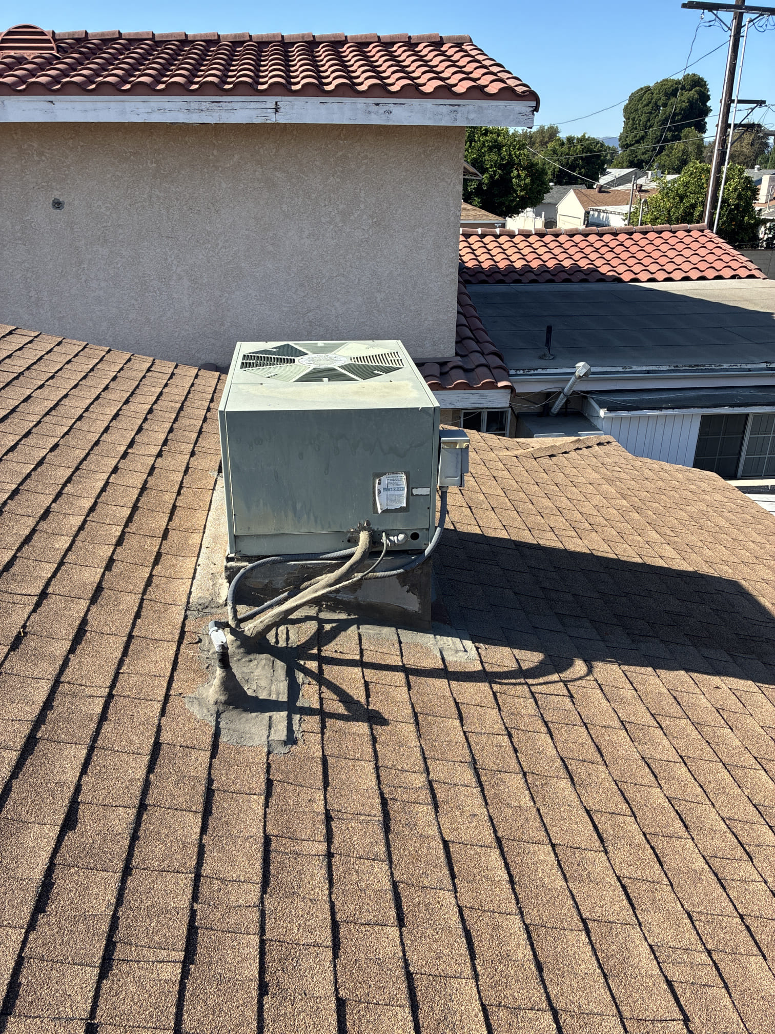 I inspected a 1999 Rheem HVAC system, revealing neglected maintenance. The indoor blower wheel was clogged with dirt, and the motor showed rust. The evaporator coil was heavily soiled, reducing efficiency. The rooftop condenser had dirty coils, and the duct system had separated asbestos joints, causing air leaks. Due to asbestos, sealing the ducts was unsafe. I recommended replacing the entire system and ductwork to restore performance and indoor air quality.