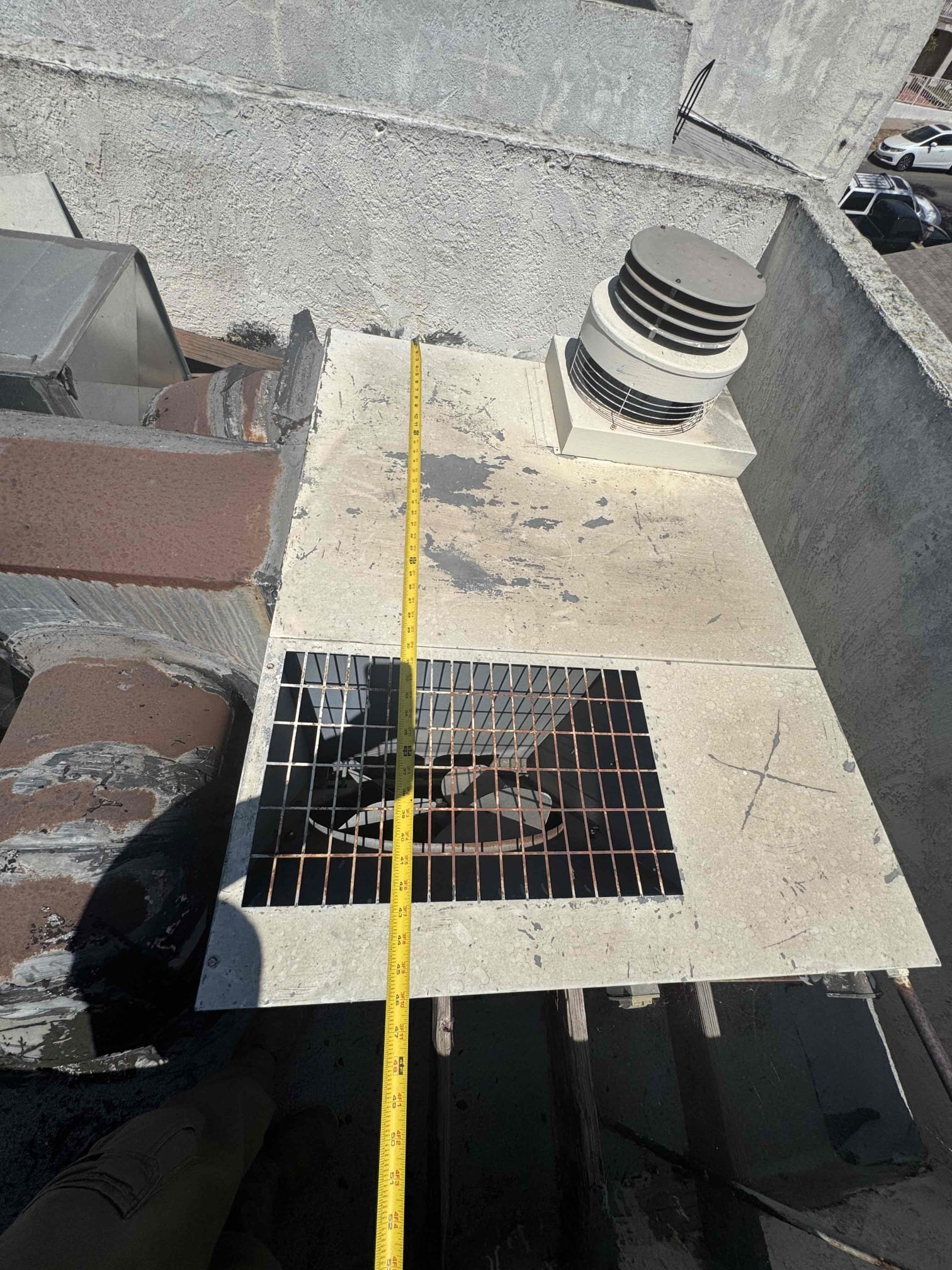 I conducted a thorough pre-engineering evaluation for the replacement of the existing rooftop HVAC system. The evaluation included a detailed inspection of the current equipment, roof access points, ductwork integrity, thermostat wiring, and the sizing of return and supply grilles. The existing system, an older R-22 packaged unit, has reached the end of its service life. Based on the findings, the replacement process is expected to be straightforward, involving the installation of a new rooftop package unit. A crane will be necessary for the removal and installation of the equipment due to the building height and roof access. Additionally, the existing roof curb may require modifications or a new adapter to accommodate the dimensions of the new equipment. The current thermostat wiring, a basic four-conductor cable, should be replaced with new thermostat wire to ensure compatibility and future serviceability.
