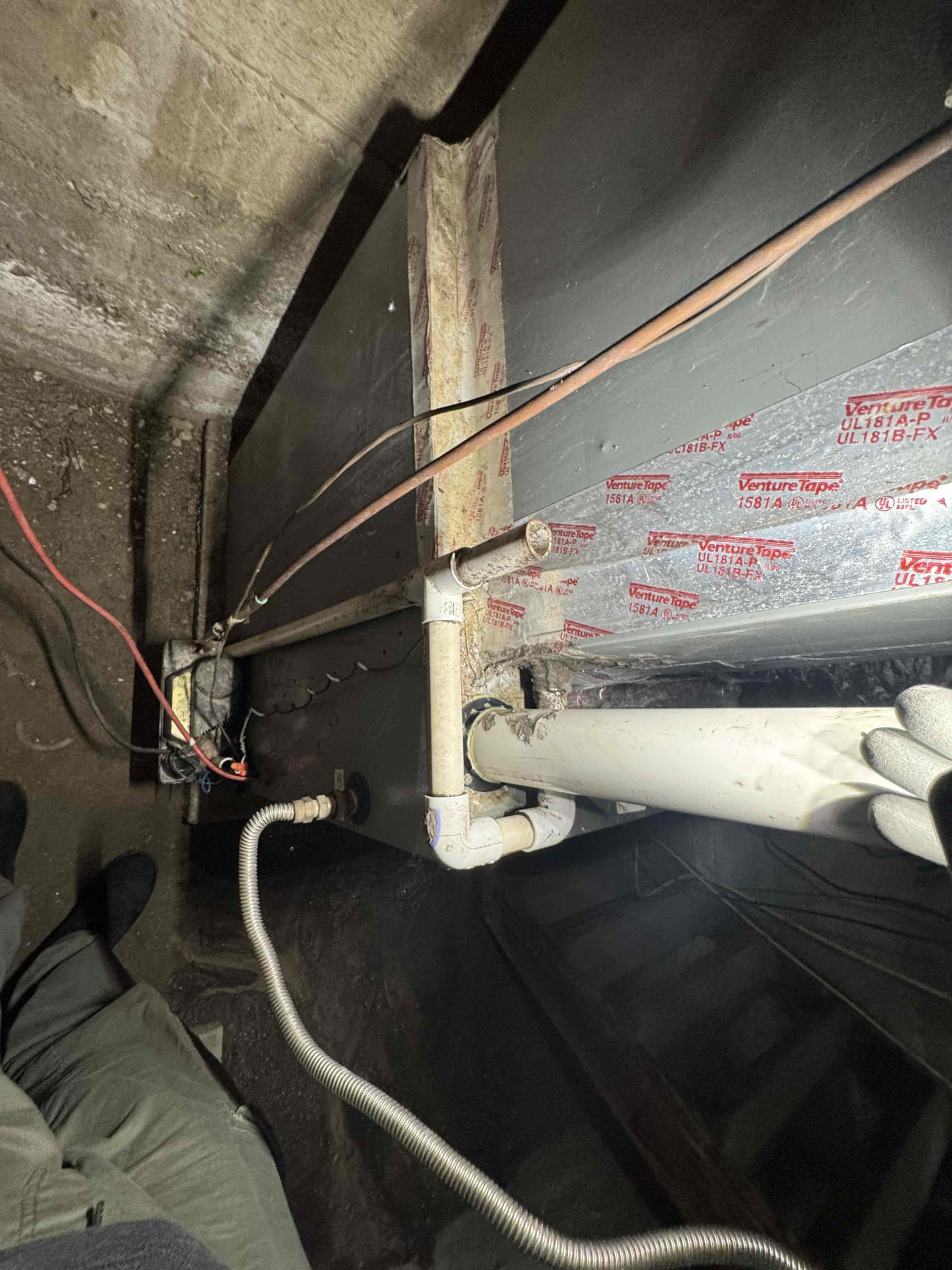 I carefully inspected the copper line and identified several small holes that needed attention. Using specialized tools, I patched these holes to ensure a secure seal. Next, I meticulously taped the coil box, ensuring that all connections were properly insulated and protected. This work was completed to maintain the efficiency and safety of the system, preventing any potential leaks or damage.
