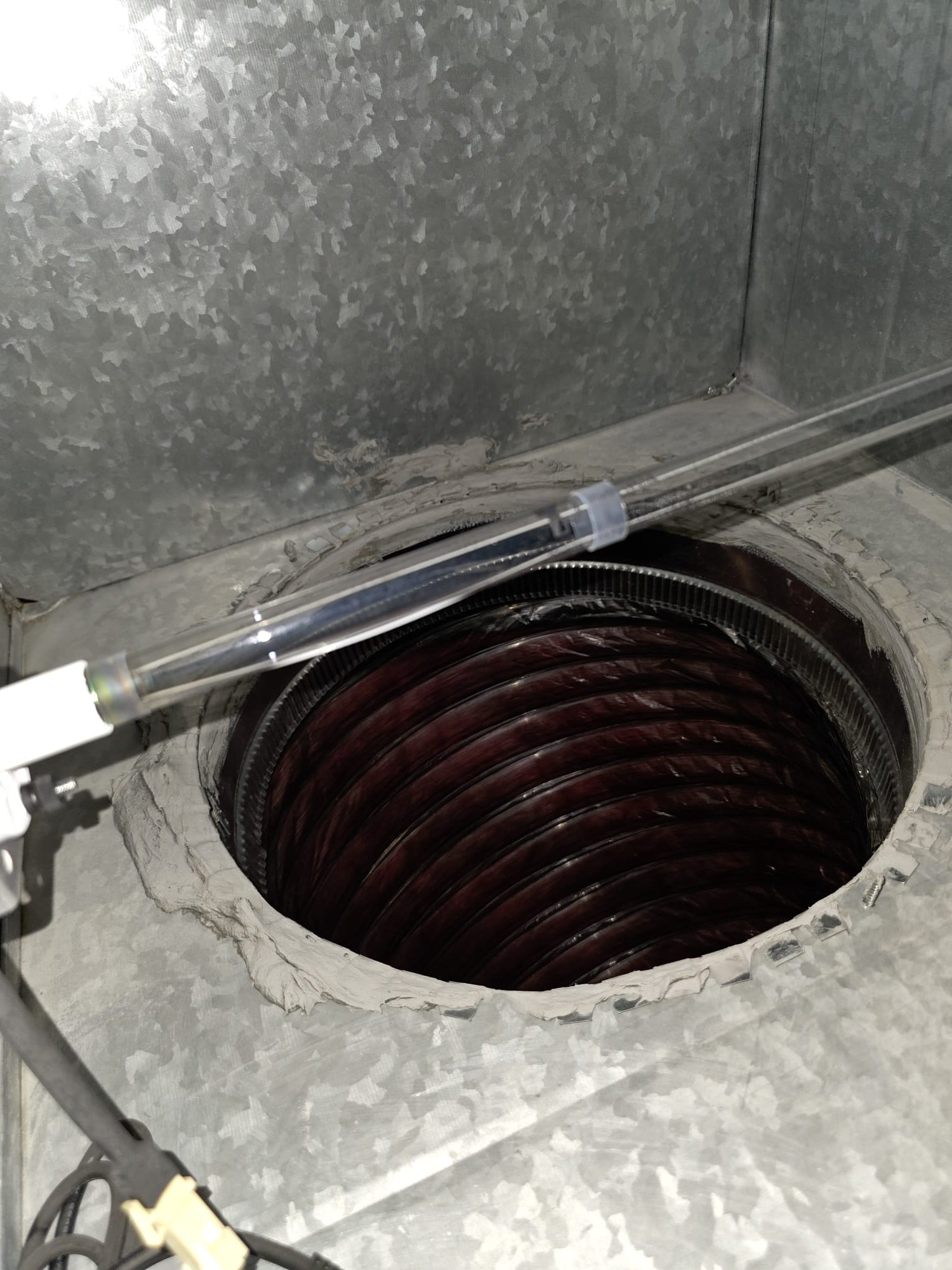 Upon arrival, I identified that the HVAC system was not cooling. The system in question was a three-ton Bryant unit using R-410A refrigerant, installed in 2024. Upon further inspection, I discovered that the condensation drain line was obstructed, causing the condensation pan to overflow with water. This overflow activated both safety switches, preventing the blower from operating. To temporarily resolve the issue, I removed the primary safety switch from the secondary drain line, allowing the system to blow cold air. Moving forward, I recommend clearing the condensation drain line and cleaning the coil to ensure proper water evacuation from the evaporator coil. Once adequate airflow is restored, the refrigerant charge should be verified and adjusted as necessary.