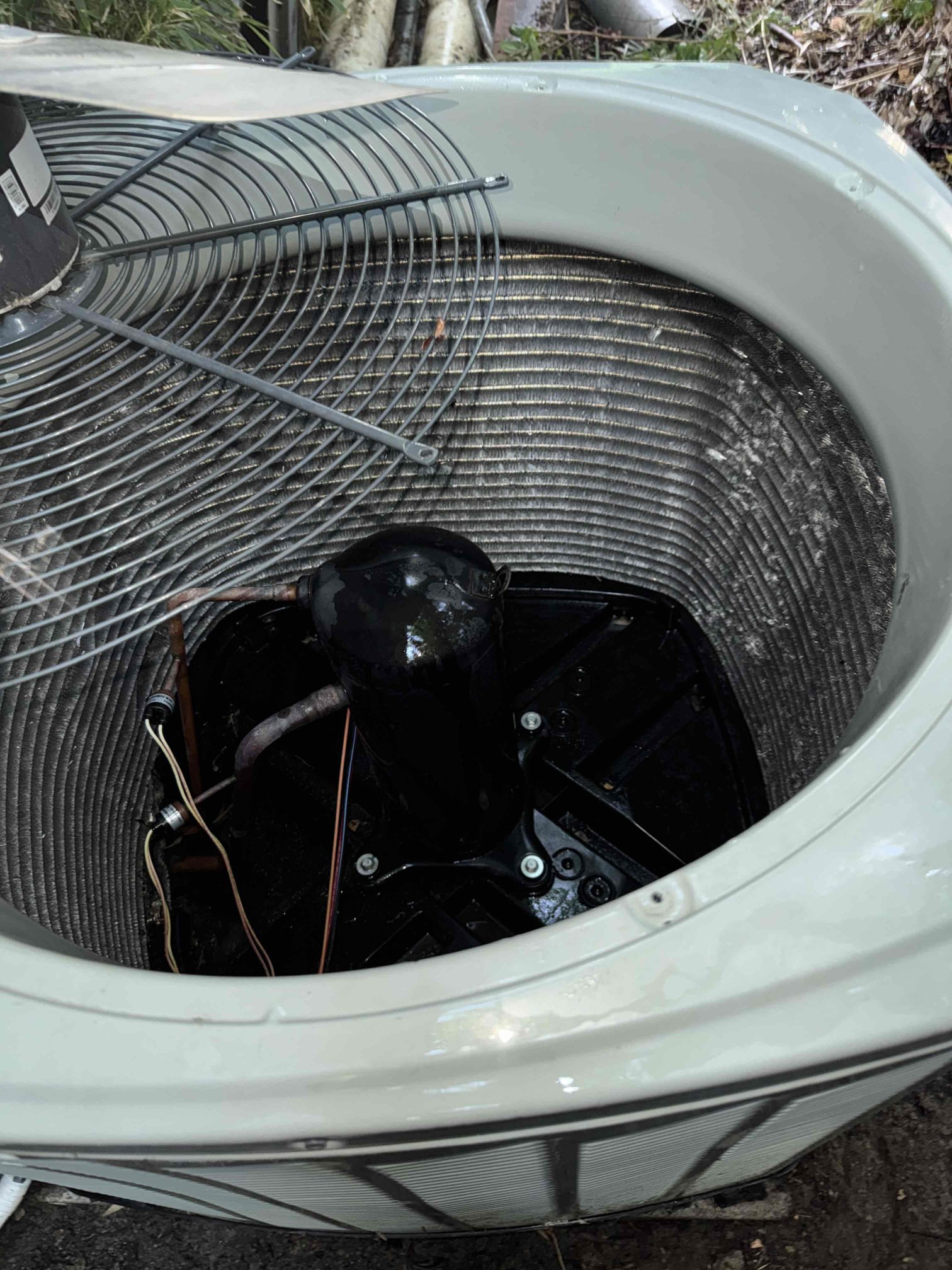 I returned to complete the approved repairs on the 2014 American Standard 4-ton system. First, I performed a thorough deep cleaning of the outdoor Spine Fin condenser coil, which was heavily impacted by dirt and debris. This involved carefully removing all accessible contaminants to ensure optimal heat transfer. Next, I replaced the failed 7.5 µF condenser fan run capacitor, which had tested at only 3.3 µF, indicating a significant failure. After replacing the capacitor, I reassembled the outdoor unit and restored its operation. I then monitored the system to allow it to stabilize. Once stabilized, I confirmed the final temperature split and verified proper cooling performance to ensure the system was functioning correctly.