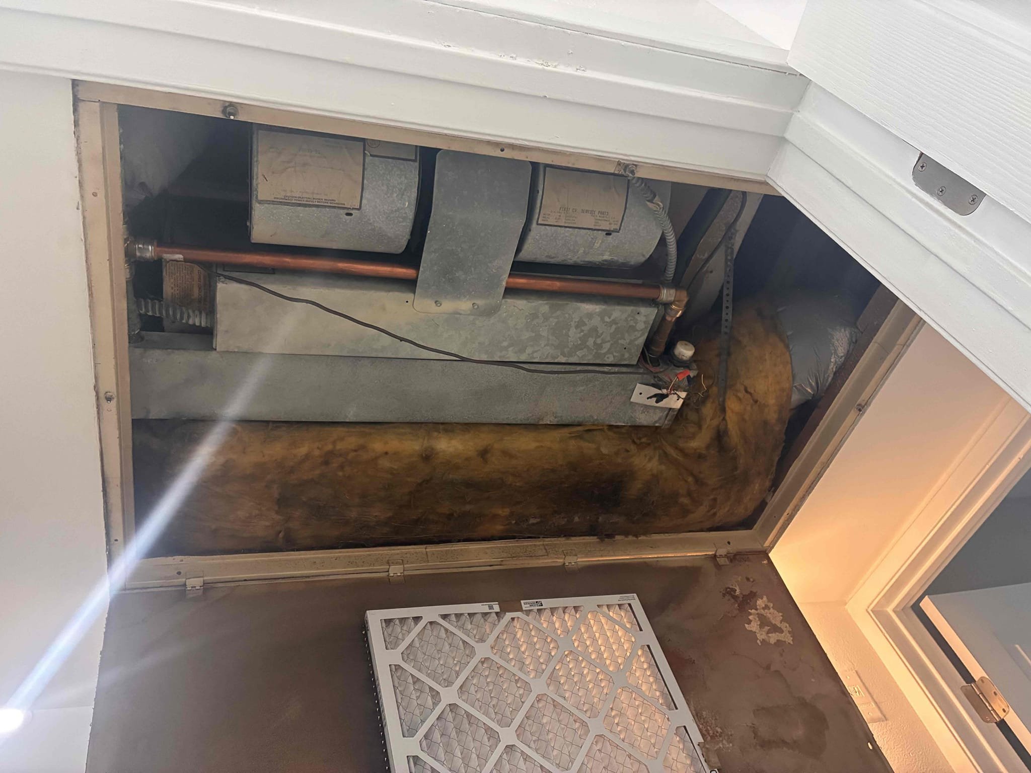 During the HVAC inspection, I tested a 1990s 1.5-ton fan-coil heat-pump system. Cooling mode functioned correctly, but heating mode failed as the rooftop condenser did not start. Power and a 24-volt heating signal reached the outdoor control board, but the reversing-valve relay did not switch. Due to the system's age and condition, repairs are not advised. Replacement parts may be hard to find, and any repair would be temporary. A complete system replacement is recommended for reliable long-term performance.