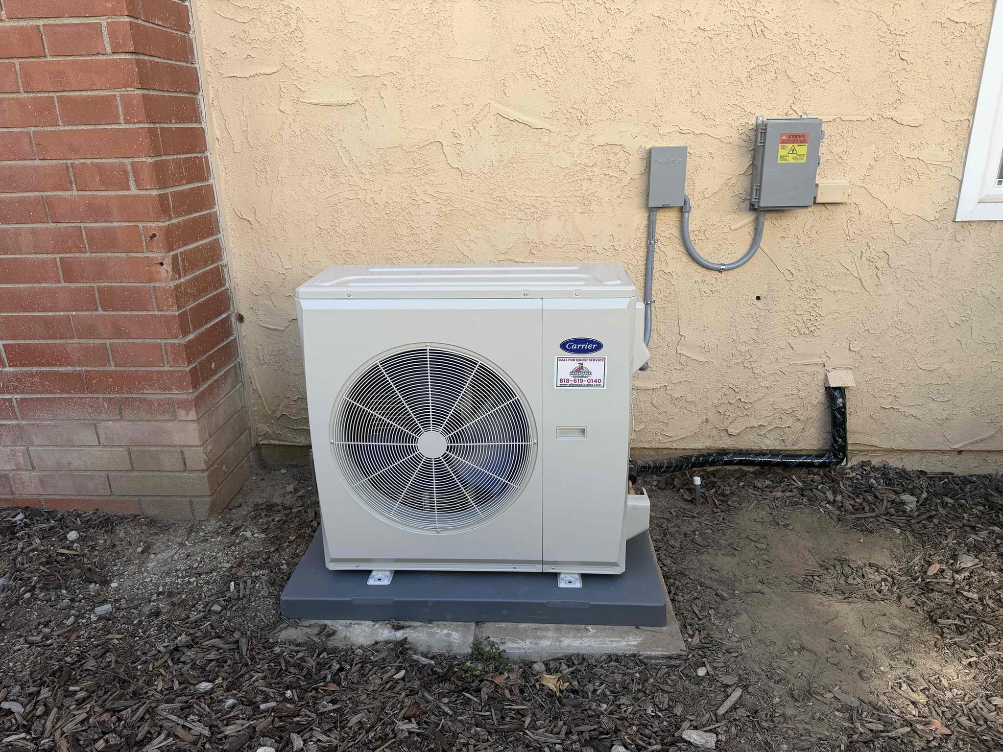 We completed a comprehensive heat pump conversion, including removing and disposing of old equipment. We installed a 5-ton 15.2-18 SEER Carrier inverter heat pump condenser and a matching air handler. Electrical connections, whips, and a condensation line were installed, along with a condenser pad and SS2 safety shut-off switch. The system was connected to existing electrical and ductwork. Carrier warranties and an extended 10-year labor warranty are included.
