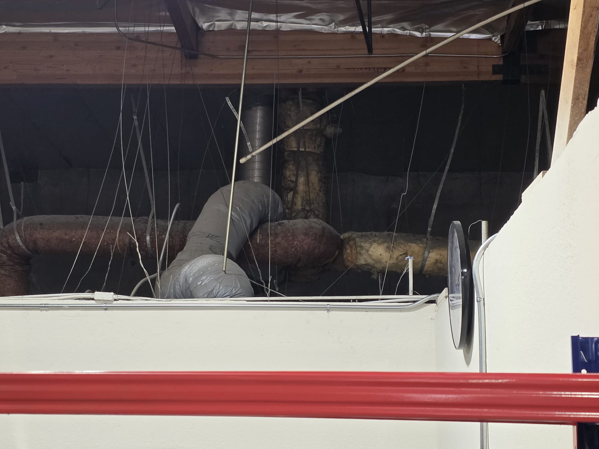 During the service inspection, I identified several critical issues with the existing ducting system. The ducting was predominantly old and leaking above the T-bar, which compromised the system's efficiency. Additionally, the ducting was not balanced properly, leading to uneven air distribution. The returns were not installed correctly, hindering optimal air exchange in a commercial setting. To enhance the system's performance, I recommended installing fresh air intake at the return plenum before the filter. Until the ducting system is replaced, the space will not achieve proper cooling.