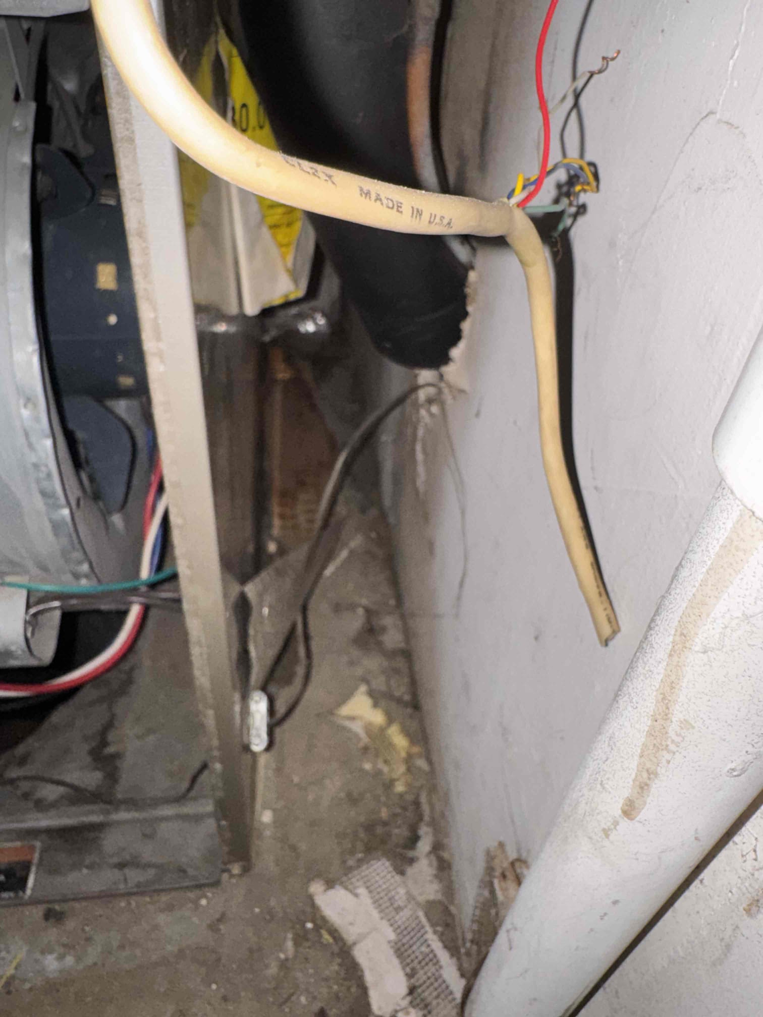 During the service, I identified a water leak beneath the blower, which was causing water to appear through the return grille. The condensate coil was not draining properly, and the primary drain lacked a proper P-trap. The SS2 float switch failed to stop operation during testing, indicating it was not providing the expected condensate safety shutoff. Additionally, mastic tape had detached from the backside seam between the coil and furnace cabinet, making resealing inaccessible during this visit. Supply air measured 73.5°F, but a return-air reading could not be obtained, so the temperature split was not confirmed. I recommend installing a proper P-trap, replacing the SS2, verifying condensate drainage, and diagnosing the associated outdoor unit to evaluate cooling operation.