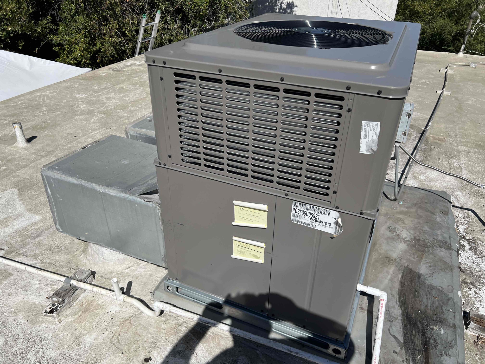 We successfully removed the old unit using a crane. Following this, we installed a new 3-ton gas-electric ultra Lonox package unit, also with the aid of a crane. We then installed a new gas flex line equipped with a shut-out valve. Additionally, we completed the installation of new electrical wiring, a whip, and a disconnect switch. A new thermostat was also installed. After installation, we started up the unit and verified its proper operation. The warranty covers 10 years on parts and one year on labor.
