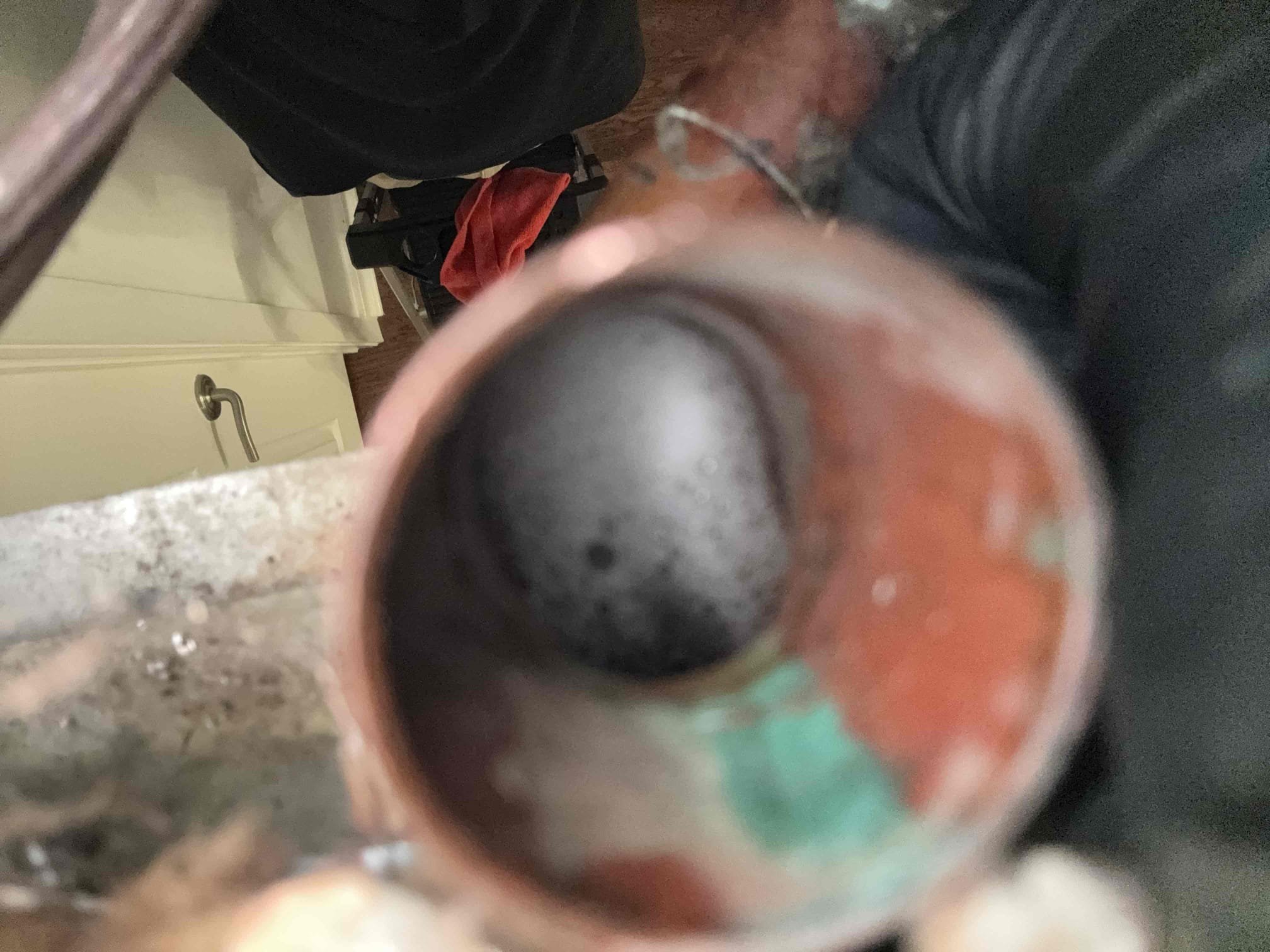 I addressed the issue by clearing the obstructed primary condensate drain line. This involved performing a nitrogen blowout to ensure all blockages were removed. Following this, I applied a Viper pan treatment to prevent future buildup and maintain proper drainage. The condensation visible in the photos originates from the breather, not the drain termination. This treatment is designed to support efficient drainage and minimize the risk of future clogs. The work ensures optimal performance and longevity of the system.