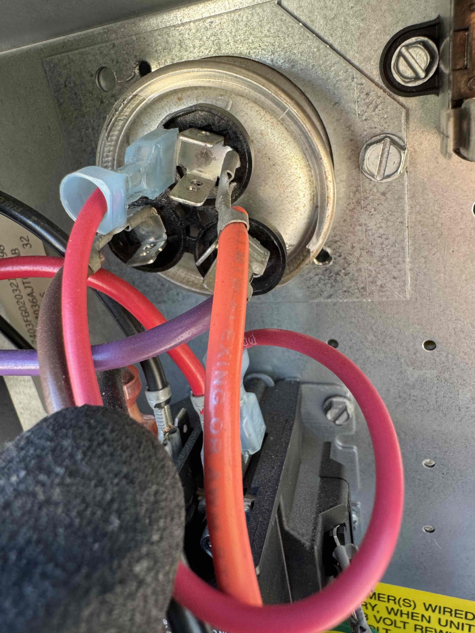 I inspected the Rheem 3-ton RTU after the indoor blower was reported running without the compressor or condenser fan. Upon testing, the dual run capacitor was found to have failed, with measured values of approximately 0.027 and 0.025 µF, significantly below the rated 45/5 µF. This failure is preventing the outdoor fan and compressor from operating. I recommended replacing the capacitor, and post-repair, cooling operation should be verified to ensure proper functionality.