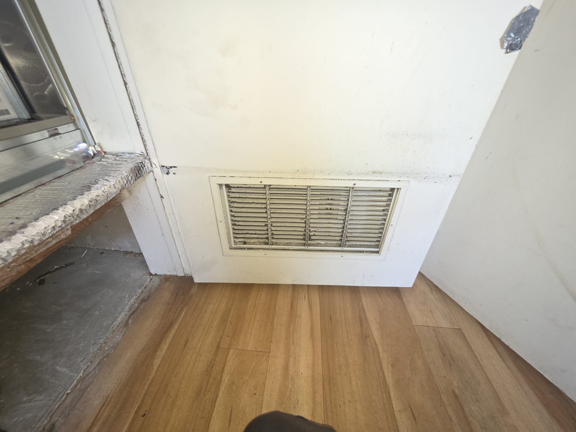 Upon arrival, I identified a four-year-old furnace that had been red-tagged by the gas company. The issue was related to the mixing of unconditioned and conditioned spaces. The return air intake could potentially draw in unconditioned air, risking carbon monoxide contamination. Additionally, negative static pressure could pull natural gas into the conditioned space. I recommended sealing the return cavity, weatherproofing the return grill, and installing duct board inside the furnace to ensure only conditioned air is introduced. Upon arrival, I identified a four-year-old furnace that had been red-tagged by the gas company. The issue was related to the mixing of unconditioned and conditioned spaces. The return air intake could potentially draw in unconditioned air, risking carbon monoxide contamination. Additionally, negative static pressure could pull natural gas into the conditioned space. I recommended sealing the return cavity, weatherproofing the return grill, and installing duct board inside the furnace to ensure only conditioned air is introduced.