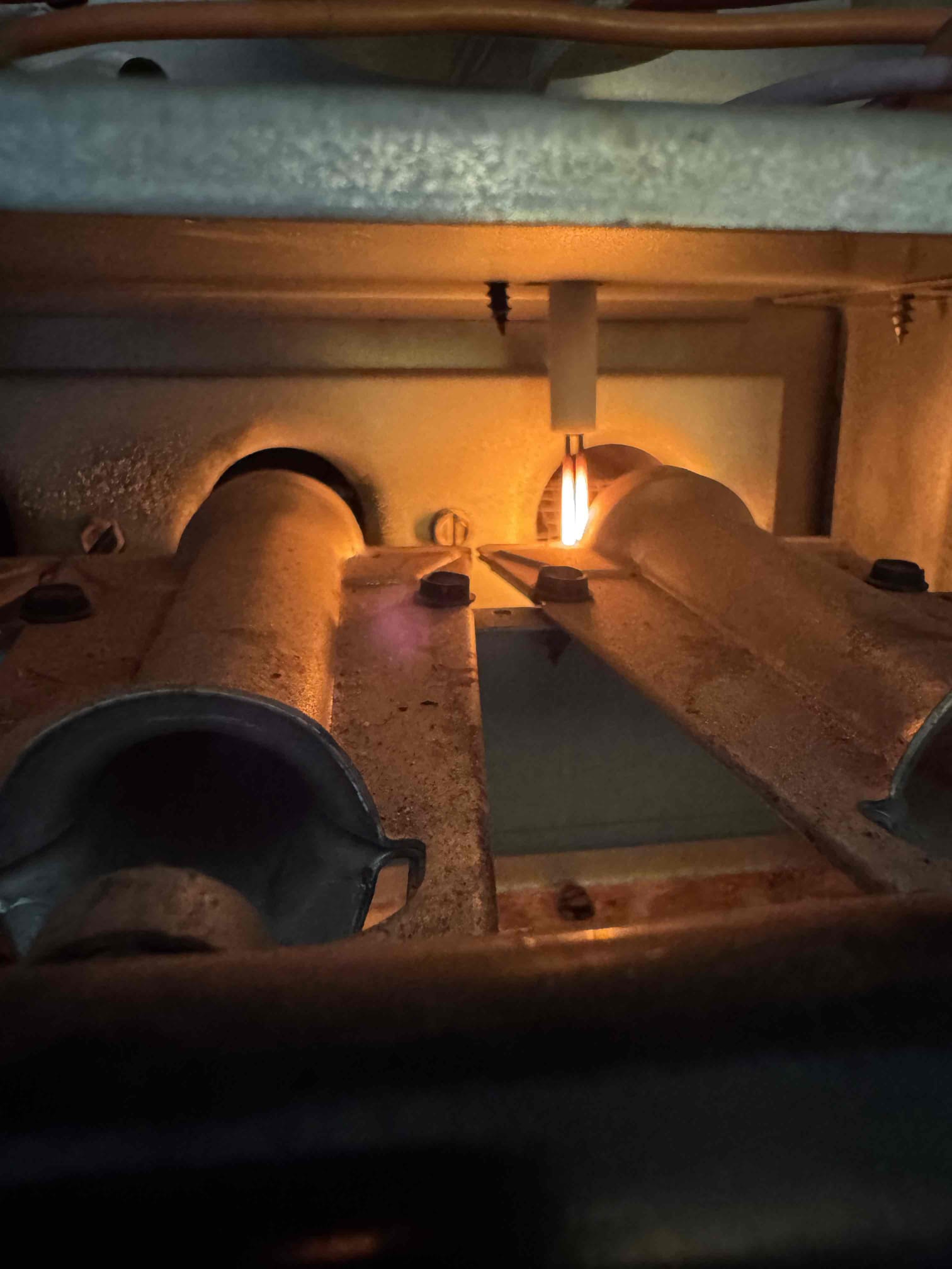 I responded to a furnace issue where it attempted to start but shut down. The furnace, a Goodman GMS80703AXA, showed the inducer operating and the hot surface igniter glowing. The igniter measured 57.99 Ω, and the gas valve’s local switch was ON. Despite 27 VAC at the gas valve and steady inlet gas pressure, no gas flow was detected at the valve outlet. Consequently, the burners did not ignite, preventing the heating cycle from completing. The gas valve is likely faulty and needs repair.