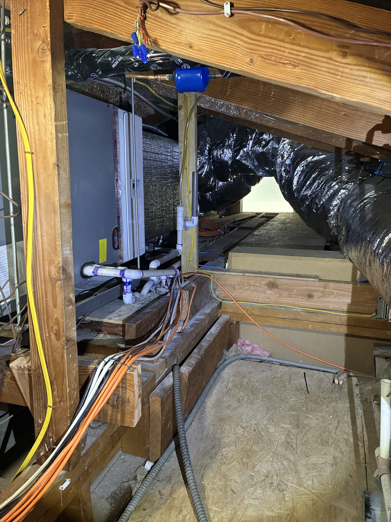 During the inspection, both HVAC systems were confirmed to be operating properly. However, several maintenance concerns were identified. For the 5-ton Daikin system, the ductwork had excessive dust and debris, and the outdoor condenser coil was dirty. The condensate drain line was shared with another system, and additional overflow protection was recommended. For the 2-ton heat pump, the condensate pump discharged into the 5-ton system’s drain line, and the emergency drain pan lacked an overflow safety switch. The air ducts and outdoor condenser coil also required cleaning. Recommendations include reconfiguring the condensate drainage, installing overflow safety switches, performing professional duct cleaning, and cleaning the condenser coils.