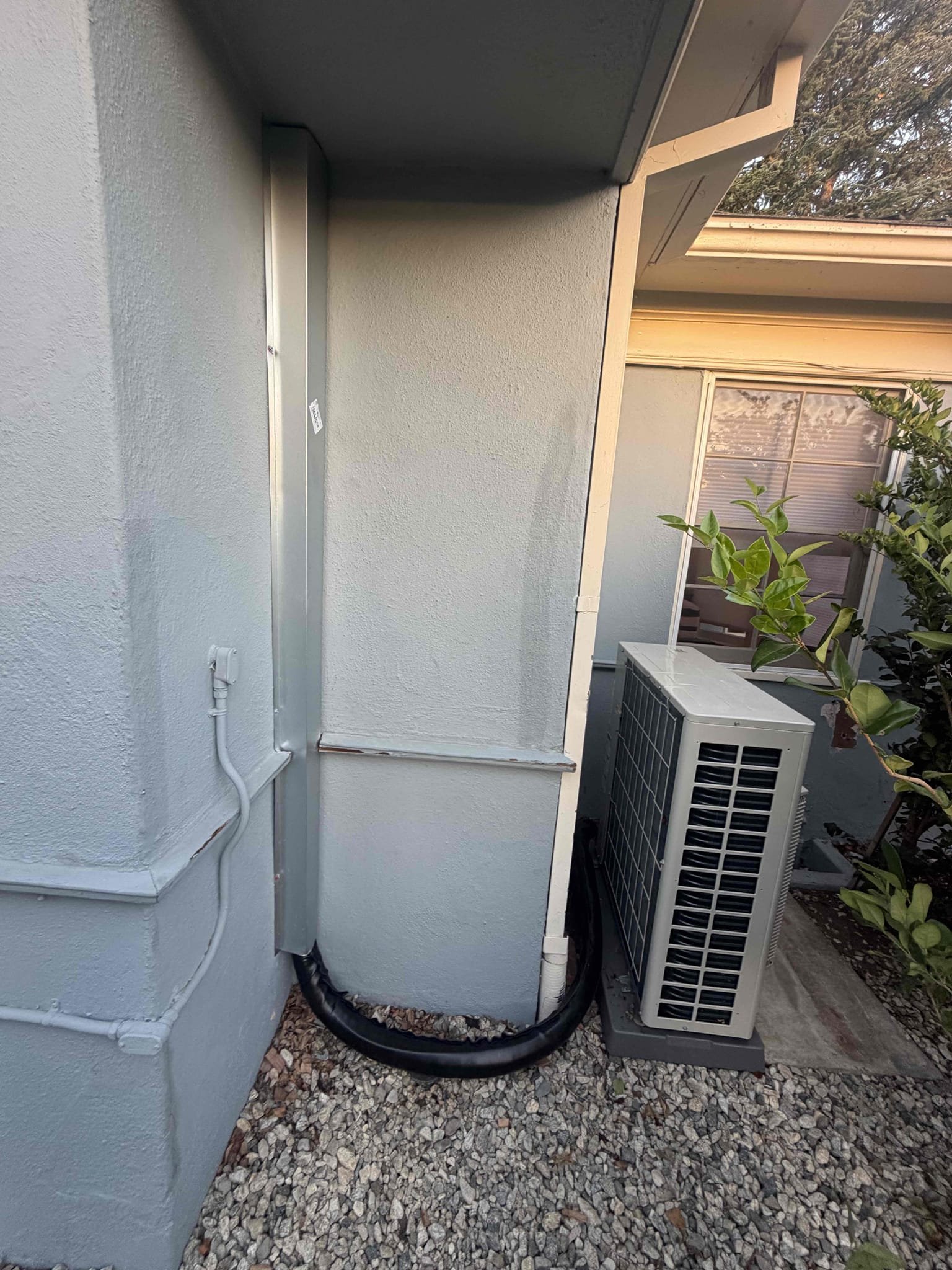 We completed a comprehensive HVAC installation project, including the removal and haul away of existing equipment. We performed asbestos abatement and installed a 5-ton heat pump condenser and air handler. The condenser was relocated, requiring the client to remove a small bush. We installed electrical disconnect boxes, whips, and a voltage monitor and surge protector. The existing condensation line was blown out, and the gas line was capped. A new condenser pad, electrical breaker, furnace stand, and thermostat were installed. We also added a safety shut-off switch, supply plenum, and supply and return ducts. The system was connected to existing electrical and low-voltage circuits. The project included a permit and HERS test.