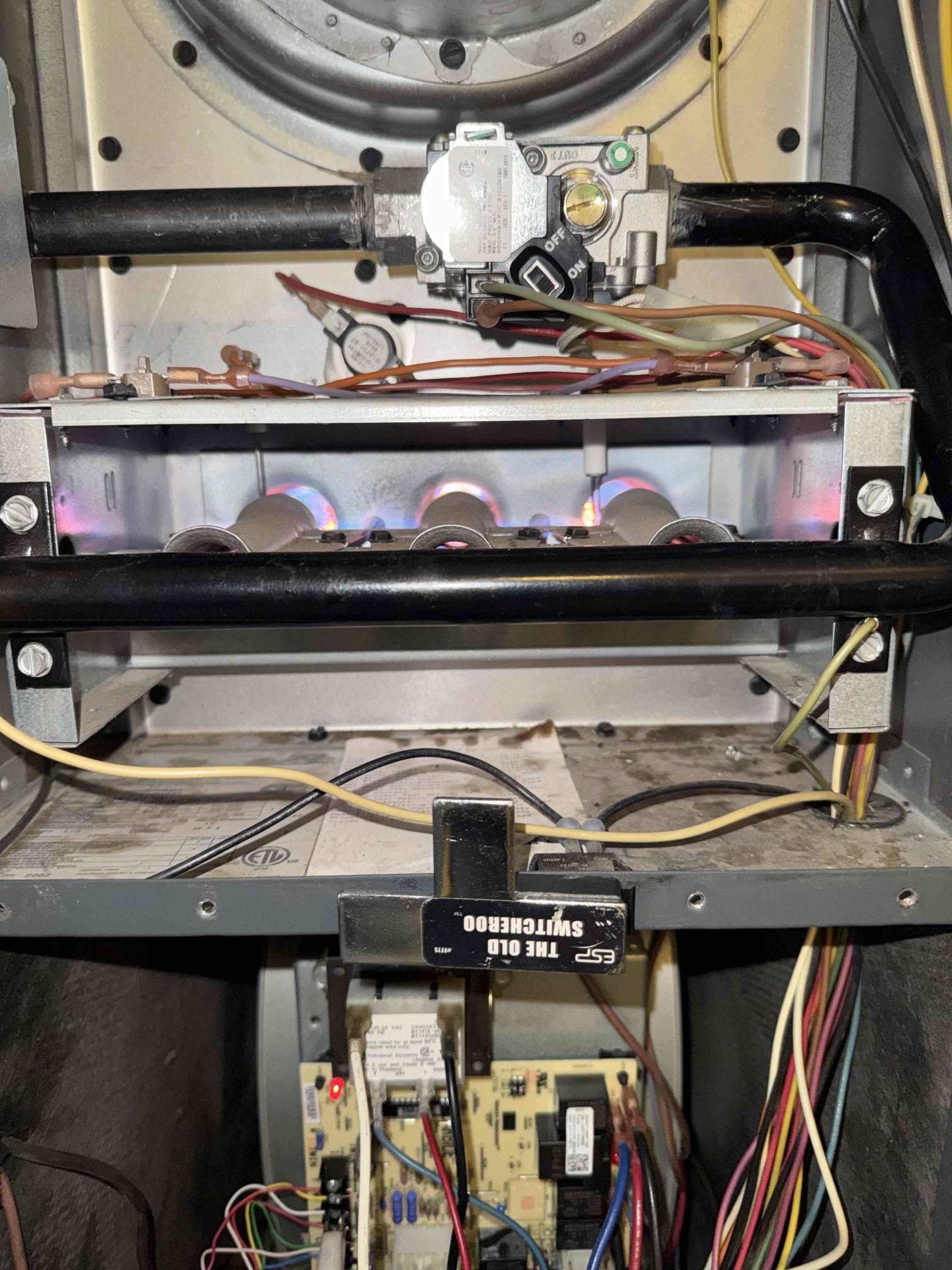 Today, I returned to complete furnace repairs and continued system testing. I replaced the OEM furnace control board due to visible heat damage and deterioration. After servicing electrical connections, the furnace successfully completed the full heating sequence and produced a stable burner flame. I verified natural-gas inlet pressure at 6.08 in. WC under load and manifold pressure at 3.49 in. WC, consistent with specifications. The temperature rise of 41.2°F was within the manufacturer’s range. All thermostat calls for heating, cooling, and fan operation responded correctly. The furnace, manufactured in October 2005, is 21 years old, and future unrelated component failures are possible. Warranty applies only to the specific parts and workmanship provided.