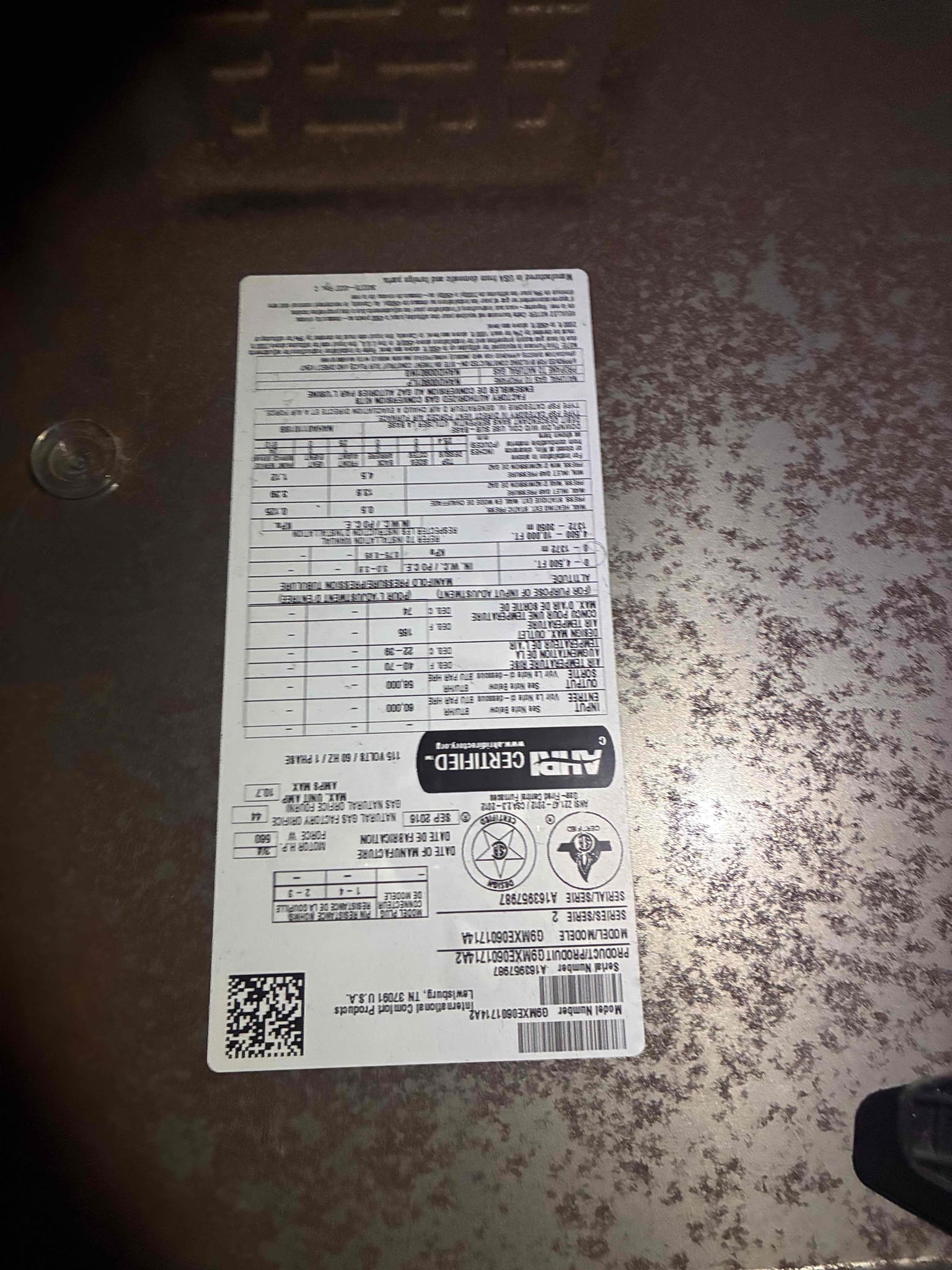 I inspected the downstairs HVAC system, a 2021 American Standard Silver 3 Ton Condenser, due to loud compressor noise, rattling, and excessive vibration. The compressor was straining during startup, producing excessive noise and vibration. I checked electrical components, amperage, and refrigerant pressures, finding suction pressure at 100 PSI, head pressure at 312 PSI, and subcooling at 0.9°F (target 10°F). The capacitor was fine, but the readings indicated a refrigerant-flow issue. I recommended replacing the compressor due to its mechanical condition. Alternatively, I suggested a temporary repair involving a new hard-start kit, capacitor replacement, and refrigerant top-off, though this is not guaranteed to resolve the issues.