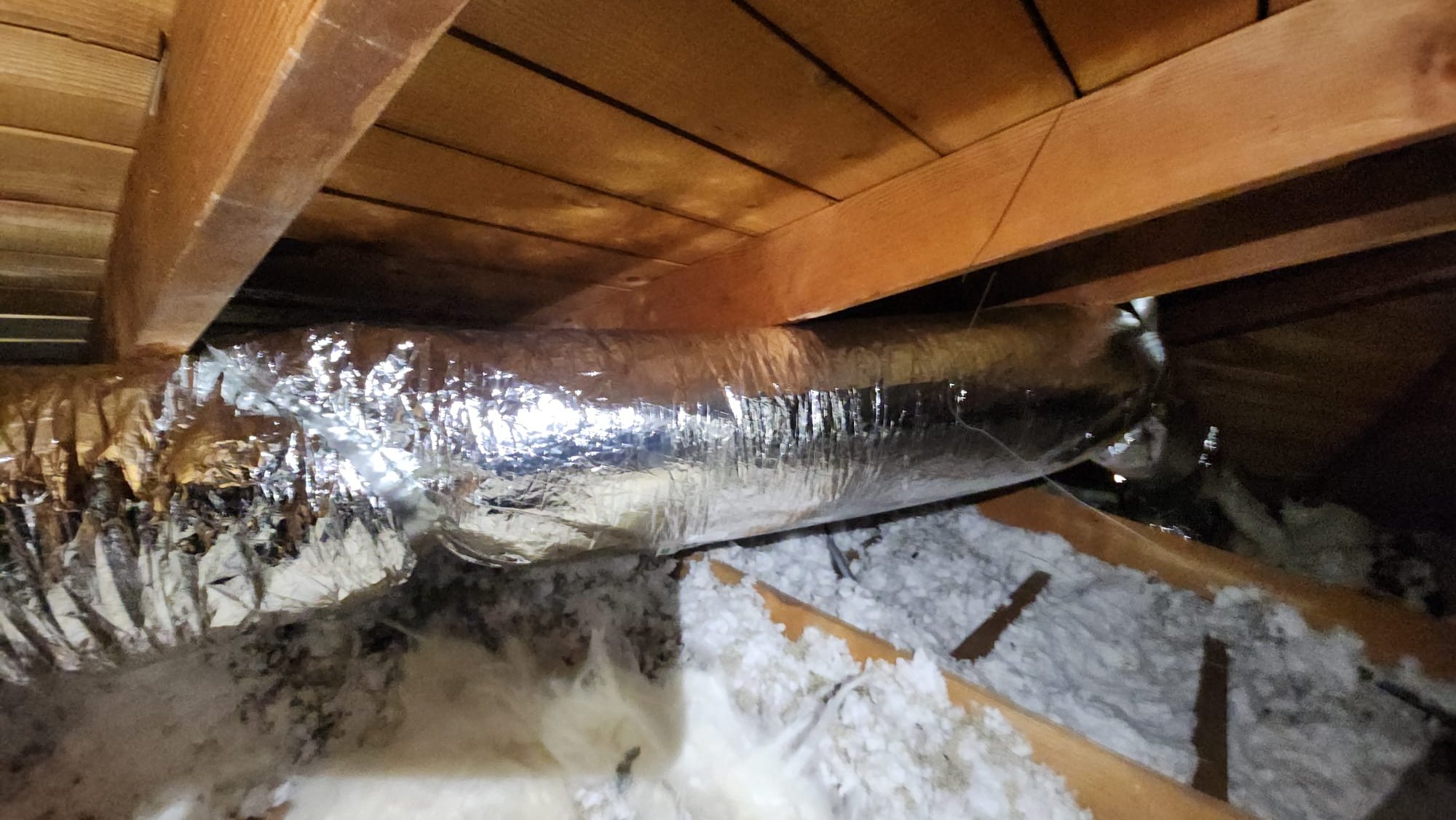 Los Angeles, CA - We carefully lifted and secured the existing 4-ton rooftop unit. A custom roof curb/transition assembly was installed, featuring an accessible return-air plenum. The existing return duct was reconnected, and an additional properly sized return-air duct and grille were installed. A new supply-air duct and register were added to enhance airflow distribution. The unit was reset, secured, weather-sealed, and reconnected. A compressor soft-start kit was installed, and we tested airflow, static pressure, temperature split, compressor startup amperage, and overall system operation. Roofing repairs beyond sealing the HVAC curb penetration were not included.