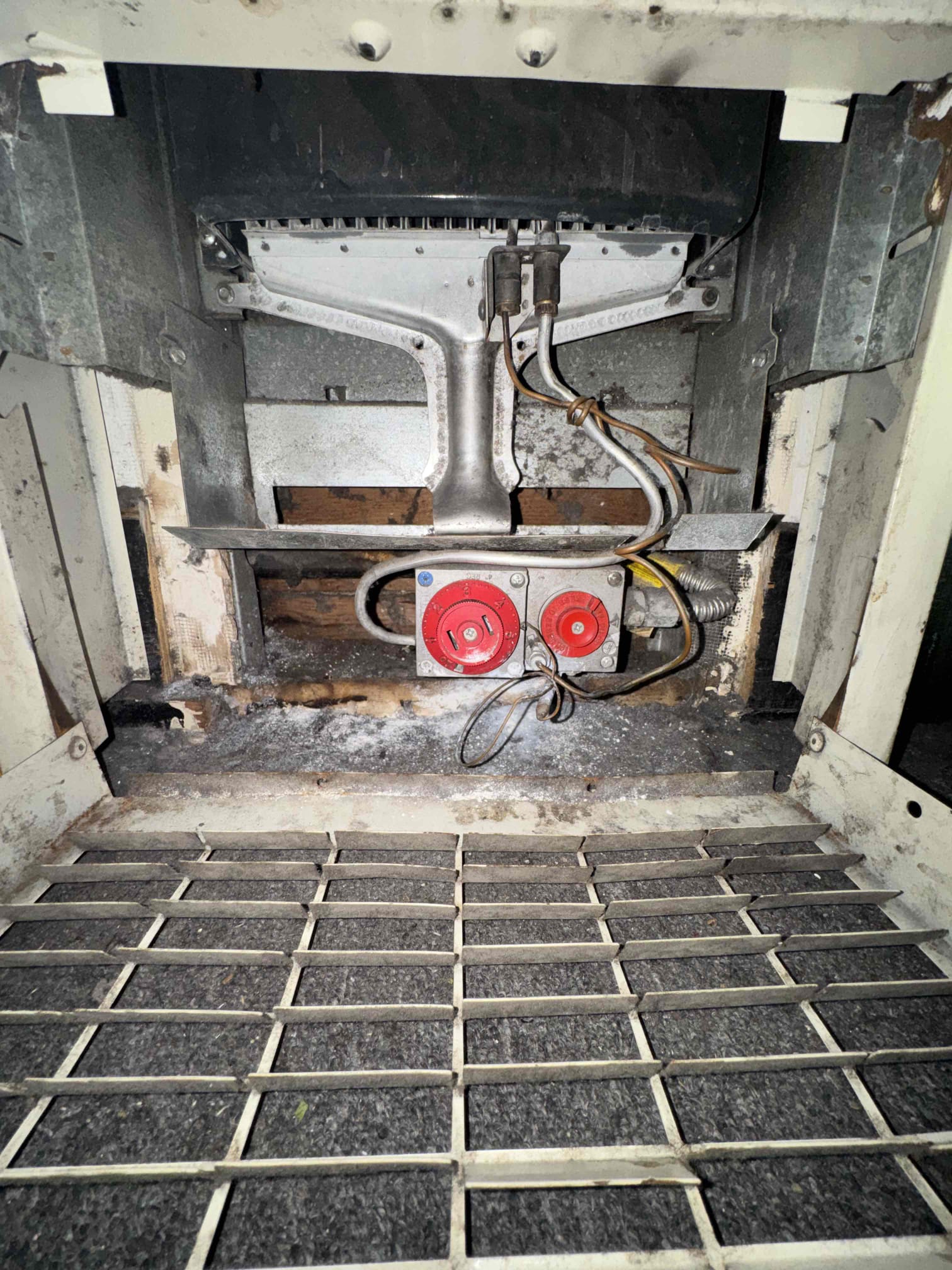 I inspected the customer's 35,000 BTU natural gas wall furnace, which was experiencing issues with the pilot light not staying lit. The unit, showing significant age and corrosion, is an older model. After thorough examination, I determined that repair is not advisable due to its condition. Potential repairs would require replacing the gas valve, thermocouple assembly, and heat-only thermostat. Given the unit's age, successful repair and continued reliable operation cannot be guaranteed. I recommended considering a replacement instead.
