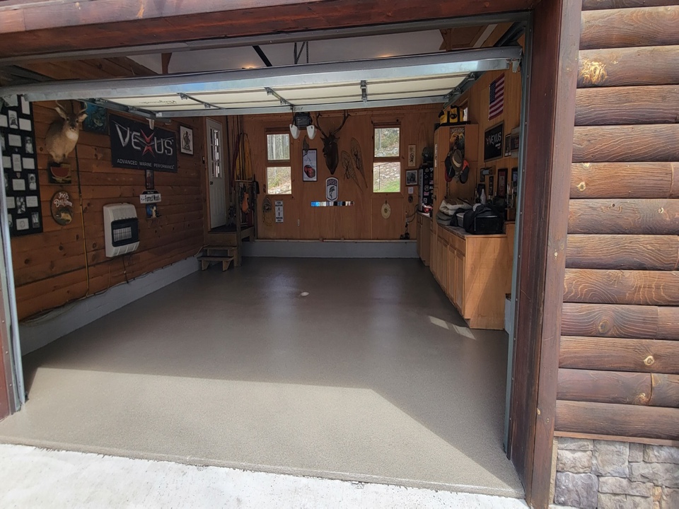 Final coat of poly 90 over this obsidian flake garage floor.🔥 Are you ready for your own decorative concrete project?
