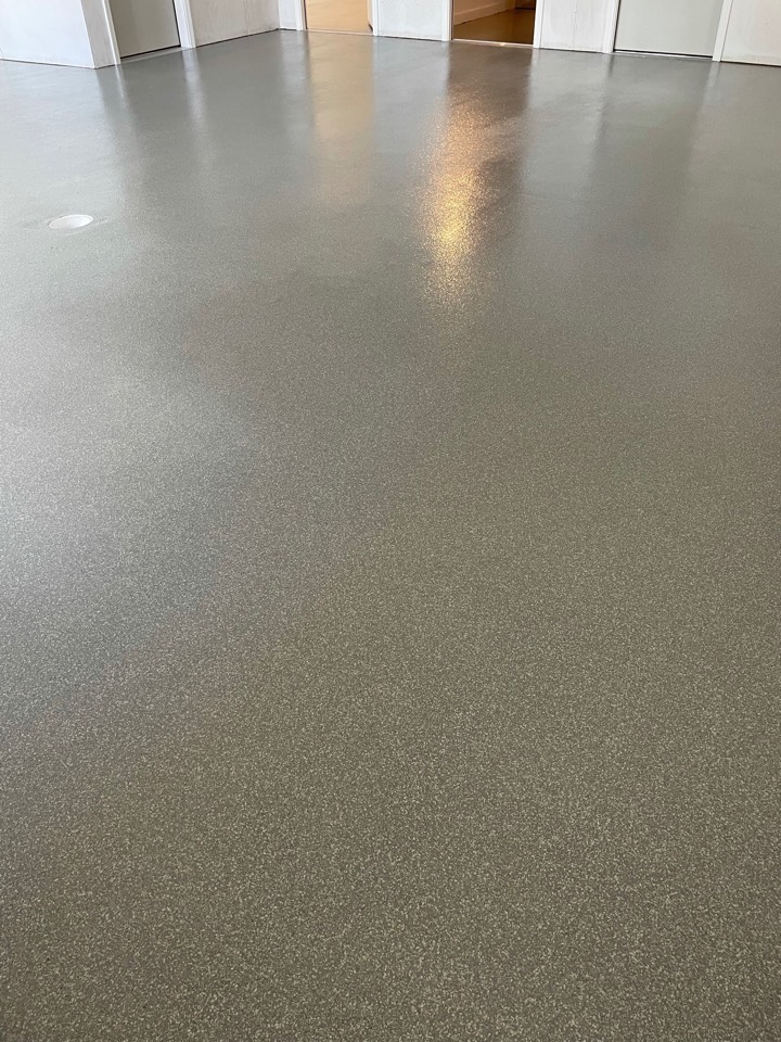 A decorative concrete flake system for this customers wood shed. Are you ready to start a resurfacing project for your concrete floors?