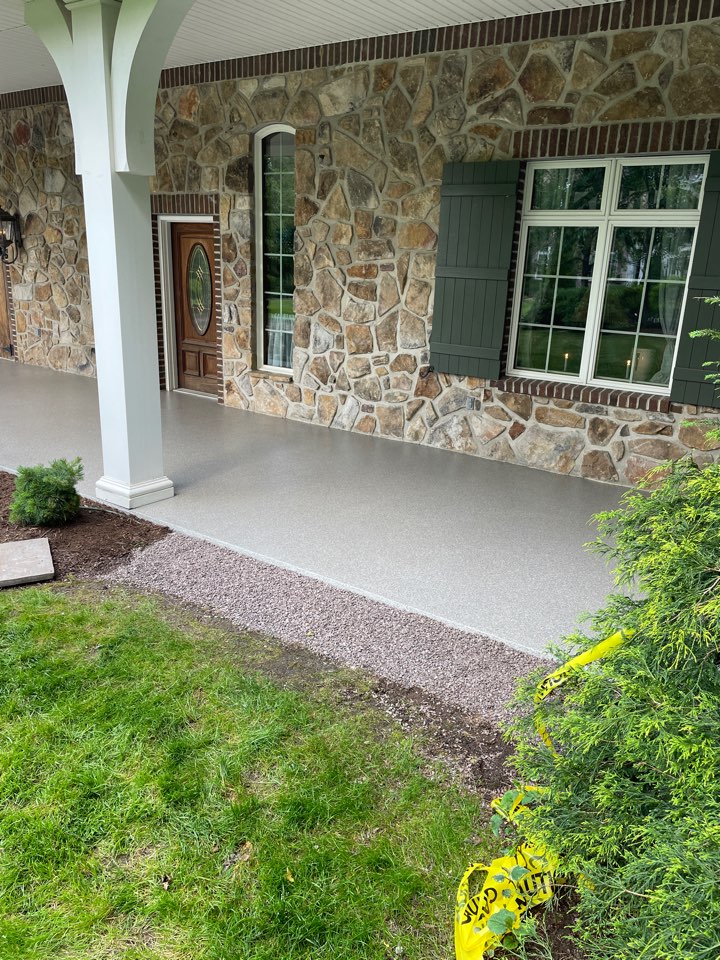 Carriage House patio in Tennessee Stone. Rough pitted concrete turned into a beautiful floor to be proud of.