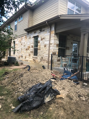 In the middle of digging holes to install piers for this until at Brodie Heights Condominium Community. This foundation repair project will continue over the next few weeks. Our steel piers hit bedrock to stabilize and lift foundations, so these residents won't have to worry about foundation settlement for years to come!