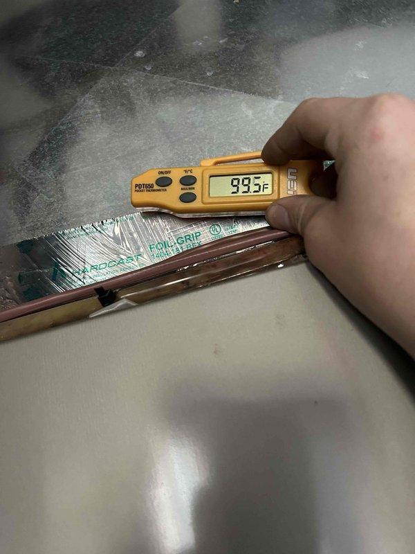Conducted follow-up service visit to address system performance issues after previous technician visit. Verified zone damper operation was correct, but discovered the system temperature settings were mismatched (downstairs on emergency heat, upstairs on standard heat). Standardized both zones to "heat" mode as required for proper zoned system operation. Measured supply temperature at 99.5°F and confirmed previous findings that the dirty 20x24x1 filter was restricting airflow.