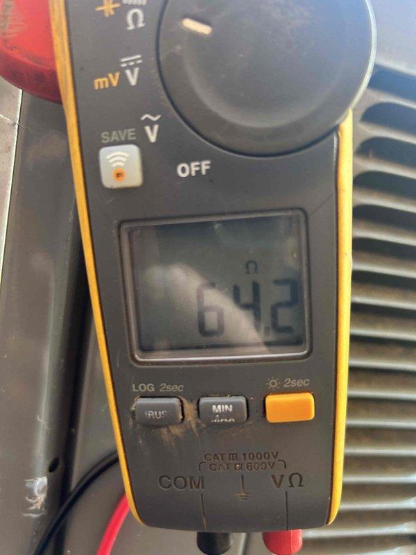 Diagnosed air conditioning system malfunction reported as "AC not working" with error code. Testing revealed high electrical resistance (642Ω) at terminal connections. Inspected and reseated wiring harness connections that showed signs of minor corrosion, restoring proper electrical continuity to system components.