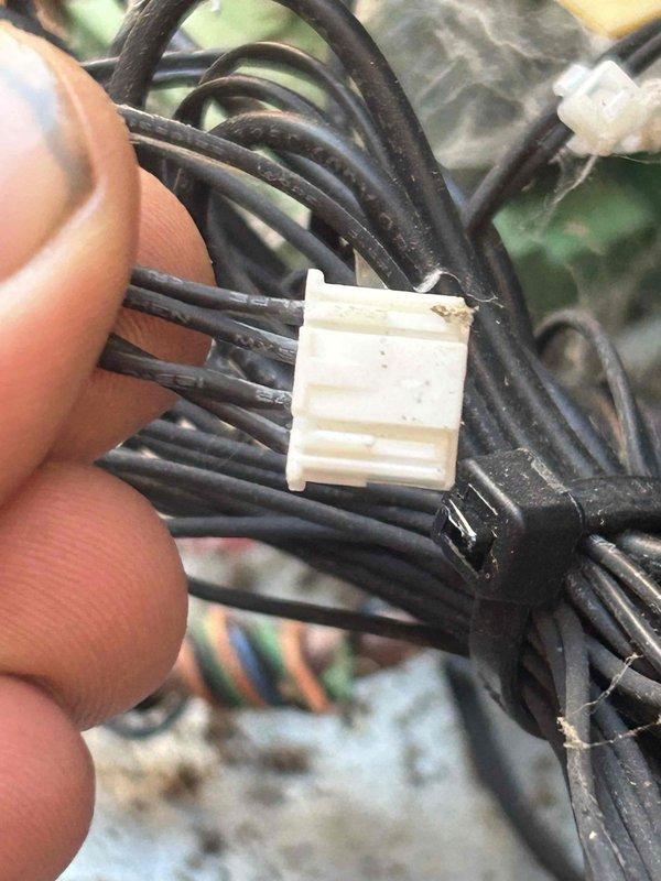 Diagnosed air conditioning system malfunction reported as "AC not working" with error code. Testing revealed high electrical resistance (642Ω) at terminal connections. Inspected and reseated wiring harness connections that showed signs of minor corrosion, restoring proper electrical continuity to system components.