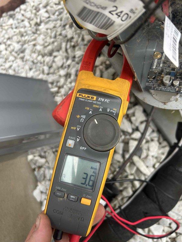Performed annual maintenance service on outdoor AC unit under 10-year membership agreement. Conducted electrical system inspection using Fluke 376 FC True RMS clamp meter with reading at 3.6 amps. All components including circuit board, capacitors, transformers, and wiring connections verified in normal working condition with no signs of damage or corrosion.