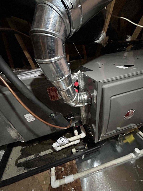 Successfully installed Rheem 80% gas furnace (R802V0754A17UHSCAP) in attic, replacing existing 90% unit. Properly capped and sealed the 90% vent pipe outside while utilizing existing 80% flue penetration, reconnected to current AC coil, return duct, gas line, and existing thermostat. Installed flame rollout protection per code requirements.