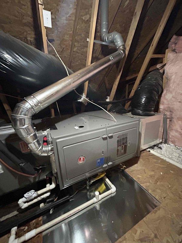 Successfully installed Rheem 80% gas furnace (R802V0754A17UHSCAP) in attic, replacing existing 90% unit. Properly capped and sealed the 90% vent pipe outside while utilizing existing 80% flue penetration, reconnected to current AC coil, return duct, gas line, and existing thermostat. Installed flame rollout protection per code requirements.