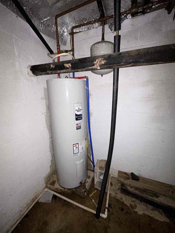 Successfully installed two Bradford White electric water heaters: a 50-gallon tall model in the basement and a 50-gallon lowboy model in the crawlspace. Reconnected both units to existing copper piping and relief valve systems, replaced batteries in flood sensors at both locations, and removed old equipment from premises.