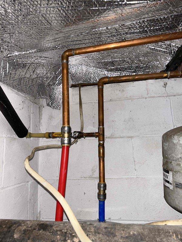 Successfully installed two Bradford White electric water heaters: a 50-gallon tall model in the basement and a 50-gallon lowboy model in the crawlspace. Reconnected both units to existing copper piping and relief valve systems, replaced batteries in flood sensors at both locations, and removed old equipment from premises.