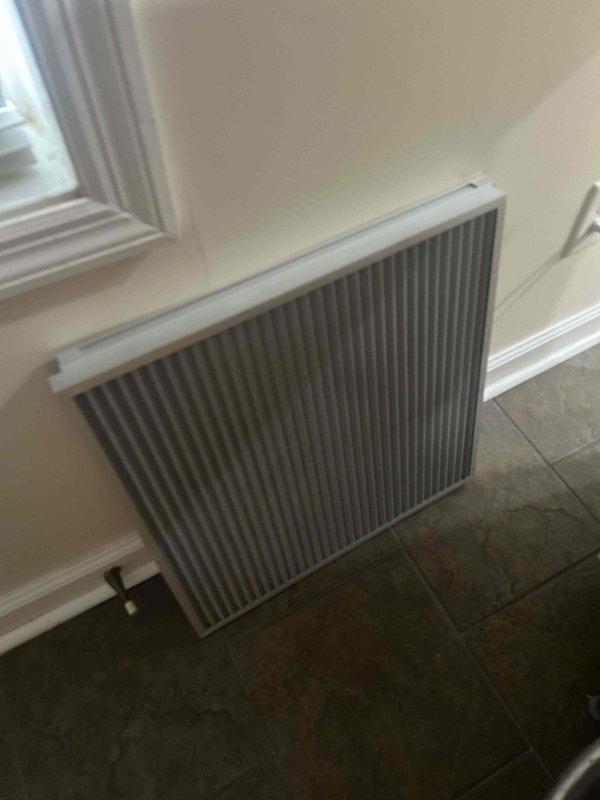 Responded to a client-reported "clanking" noise from the cold air return system located in attic. Upon inspection, removed and examined the return air grille and filter assembly, finding debris causing fan blade interference. Cleaned components and reinstalled correctly, eliminating the noise issue during system operation.