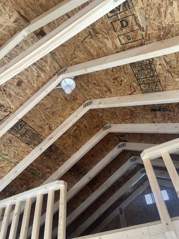 Installed a 200AMP panel (Rapp 12x281) with two breakers in new construction framing. Completed rough-in electrical work including installation of one GFCI outlet, one duplex receptacle, one single pole switch, and two keyless fixtures with bulbs. All components properly secured to OSB walls and ceiling framework per code requirements.
