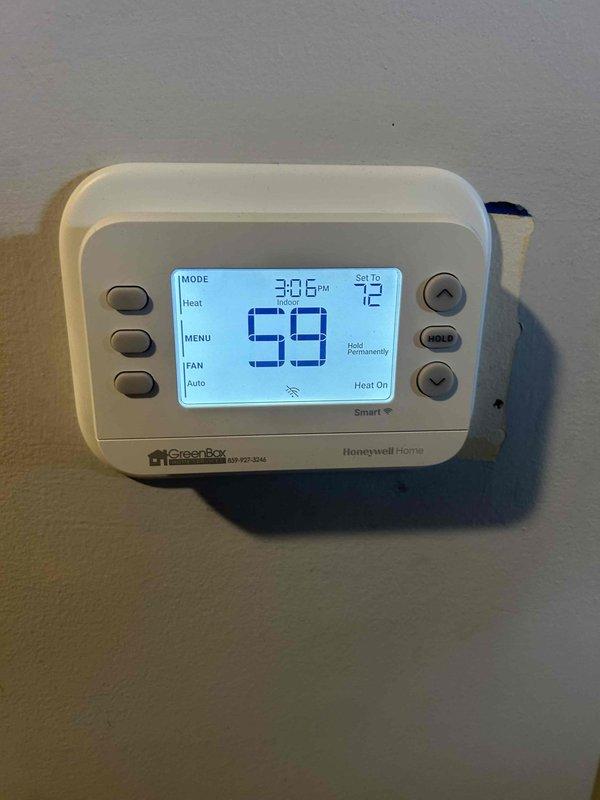 Responded to callback regarding temperature discrepancy on Honeywell thermostat. Verified system was not maintaining set temperature of 72° while actual temperature read 61°. Determined there was a communication failure between thermostat and previously installed mitigation board. Replaced faulty thermostat, tested system operation, and confirmed proper heating function with all components now communicating correctly.