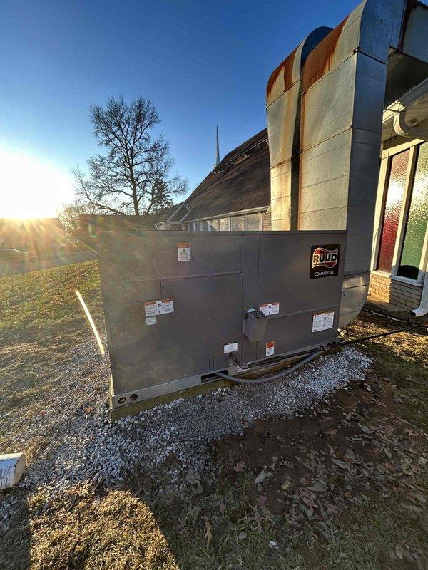 Successfully completed installation of RUUD 10-ton Gas Package Unit (model RGEDZT120ACG222AAAA0) by repositioning existing pad to accommodate new equipment dimensions. Reconfigured electrical and gas connections and fabricated transition to integrate with existing ductwork and thermostat, ensuring complete system compatibility.