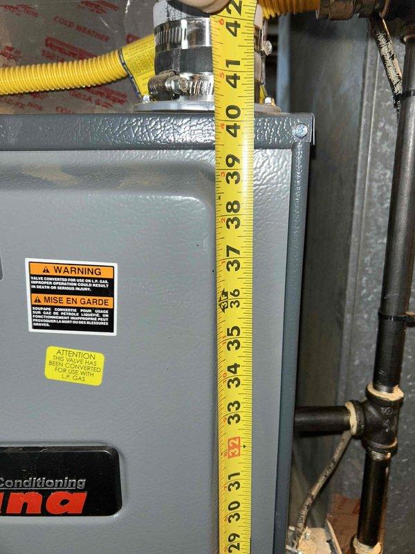 Responded to service call for a gas furnace over 10 years old with no heat issues. Diagnosed system failure in basement-installed Carrier unit. Inspected gas line connections and took measurements of the equipment dimensions to ensure proper clearances and ventilation. Restored heating functionality by cleaning flame sensor and resetting ignition sequence.